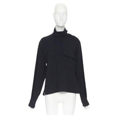 Victoria Beckham, camicetta in crêpe nero con taschino e colletto a strappo, UK8 M.