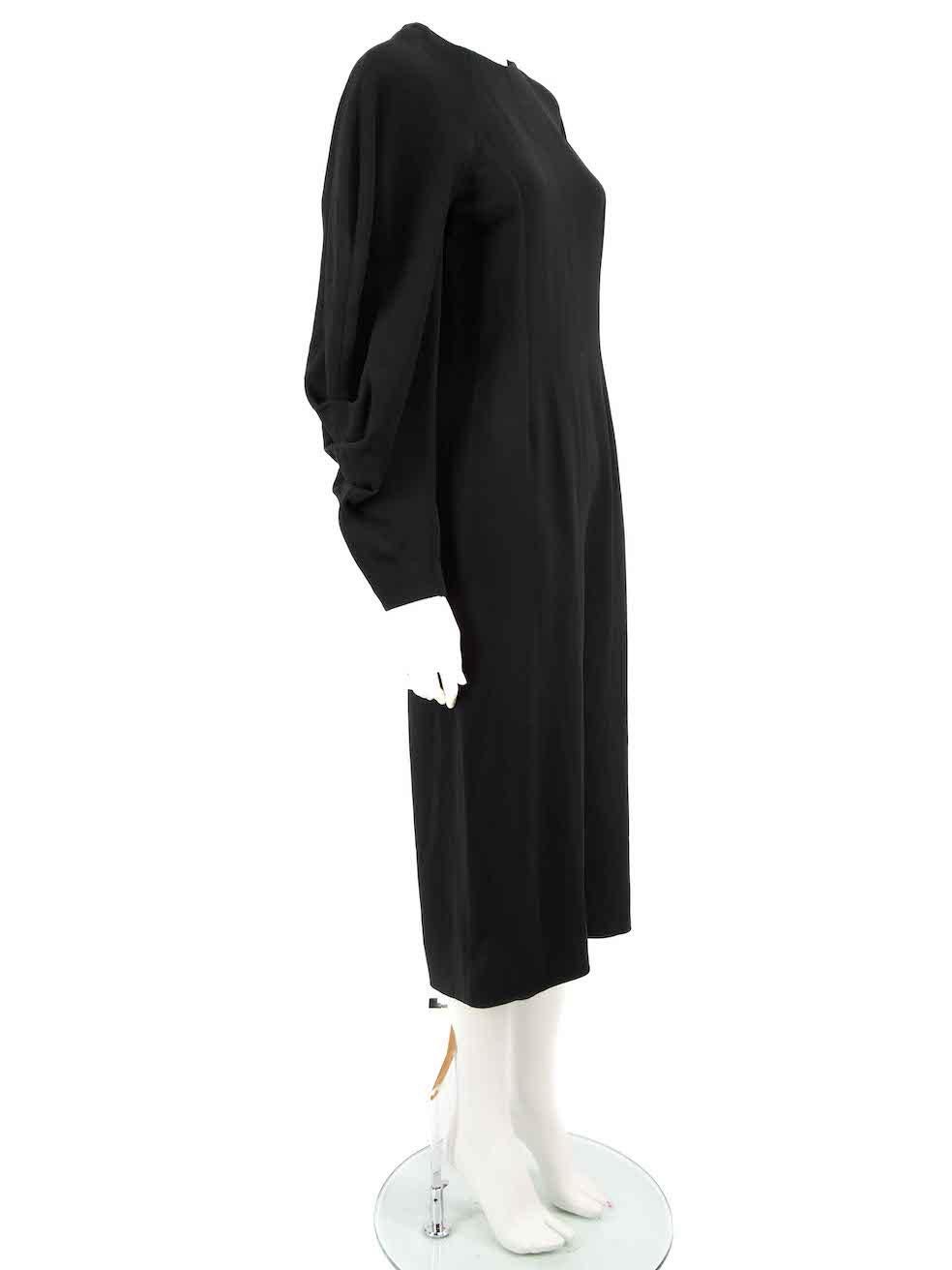 CONDITION is Very good. Minimal wear to dress is evident. Minimal pull to thread to rear hemline near zipper on this used Victoria Beckham designer resale item.
 
 
 
 Details
 
 
 Black
 
 Viscose
 
 Dress
 
 Midi
 
 Back open ended zip fastening
