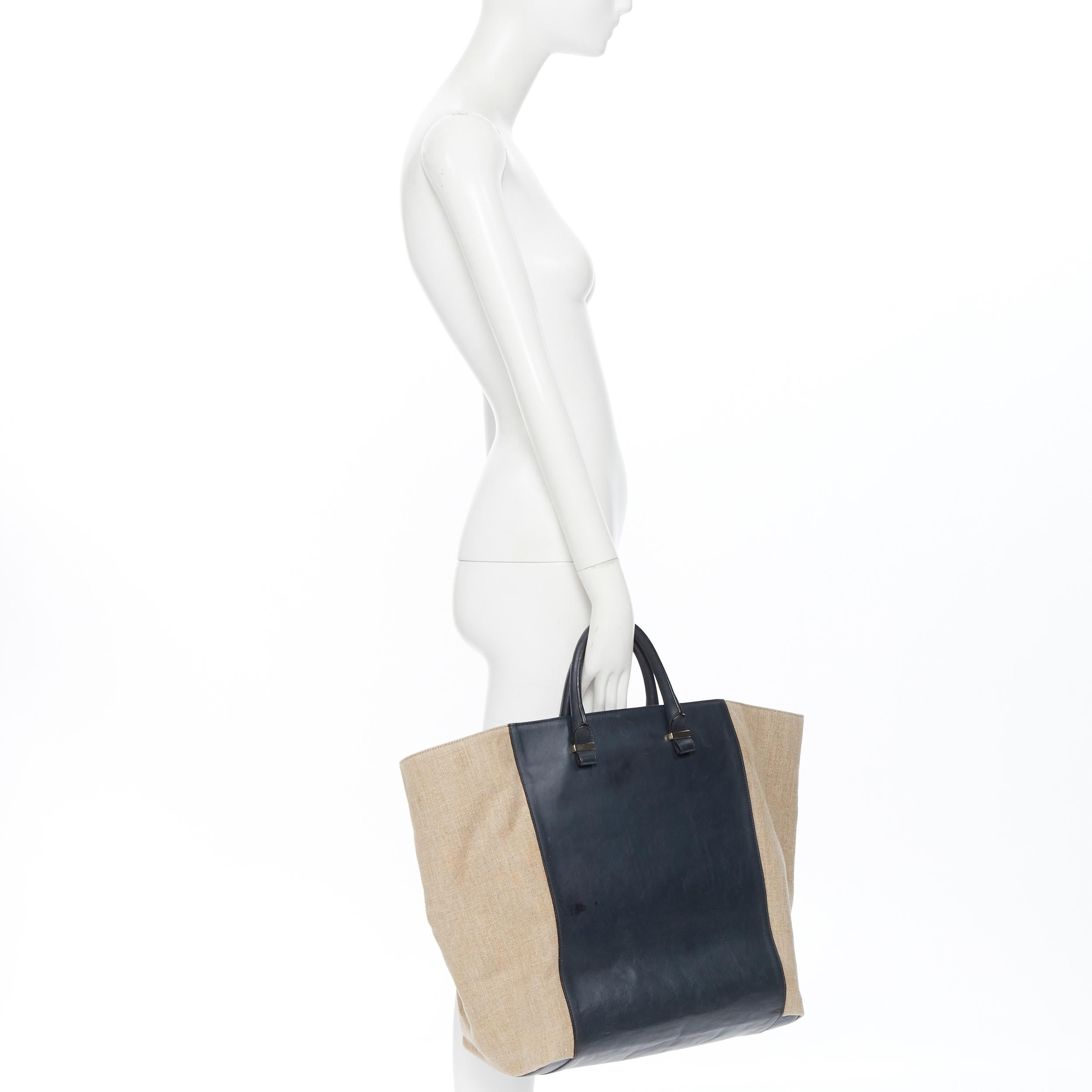 VICTORIA BECKHAM black leather beige canvas flared side large casual tote bag
Brand: Victoria Beckham
Designer: Victoria Beckham
Model Name / Style: Tote bag
Material: Leather, canvas
Color: Black, beige
Pattern: Solid
Extra Detail: Flared sides