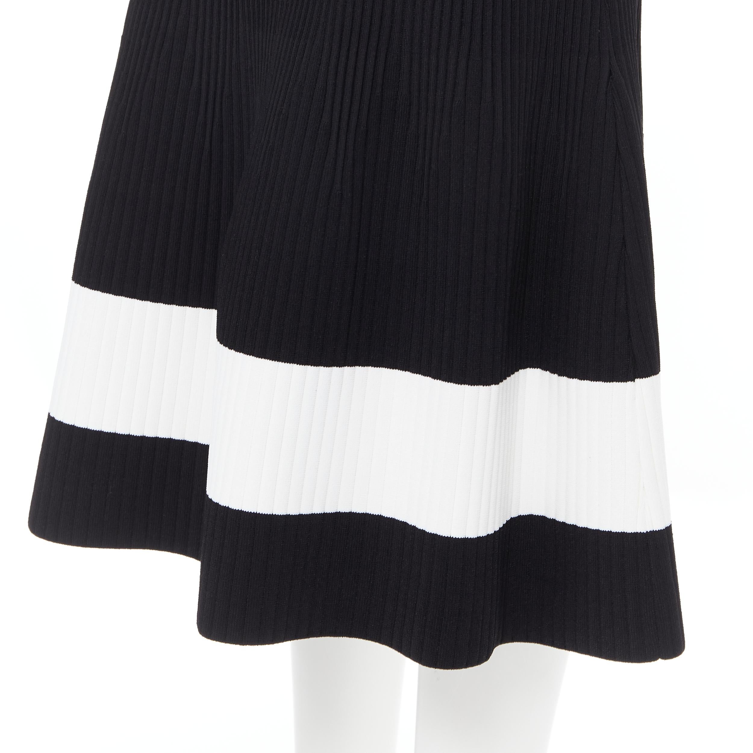 VICTORIA BECKHAM black white colorblocked ribbed fit flare midi skirt XS 
Reference: LNKO/A01759 
Brand: Victoria Beckham 
Designer: Victoria Beckham 
Material: Viscose 
Color: Black 
Pattern: Solid 
Closure: Zip 
Extra Detail: Ribbed knit.