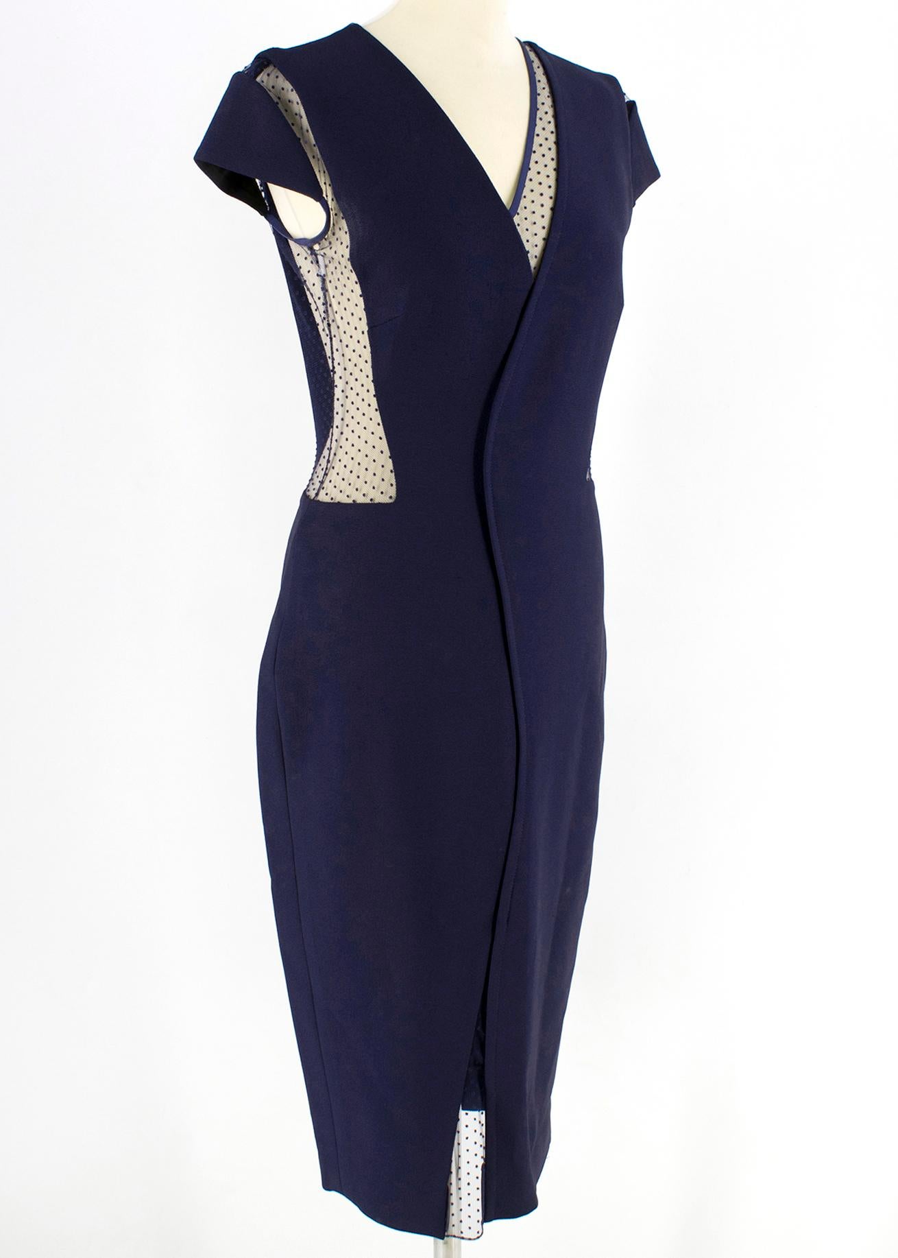 Victoria Beckham Blue Tulle Panelled Fitted Dress

Navy blue short sleeve dress
V-neck design with sheer lace detailing
Patterned sheer inserts at the neckline, waist, shoulders and hem
Short capped sleeves
Small slit in the hem of dress
Rear