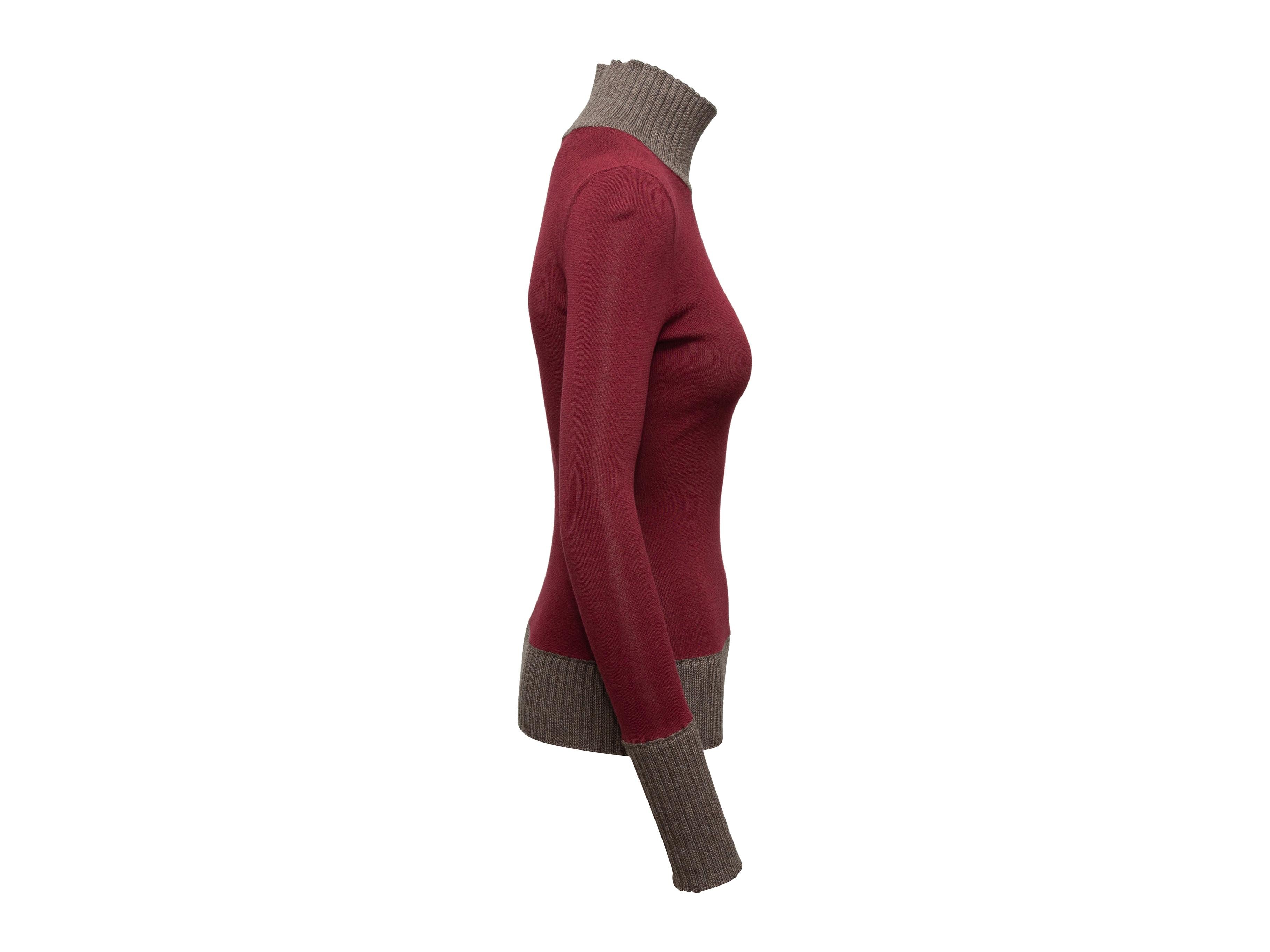 Product details: Burgundy red and brown turtleneck sweater by Victoria Beckham. Rib knit texture throughout. 23