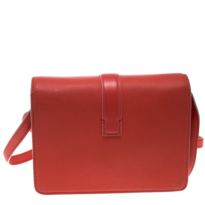 Victoria Beckham is known to create stylish and very sophisticated creations and this bag is one such piece that will add sparks of luxury to your closet. This coral red bag is crafted from leather and features an elegant silhouette. It flaunts a