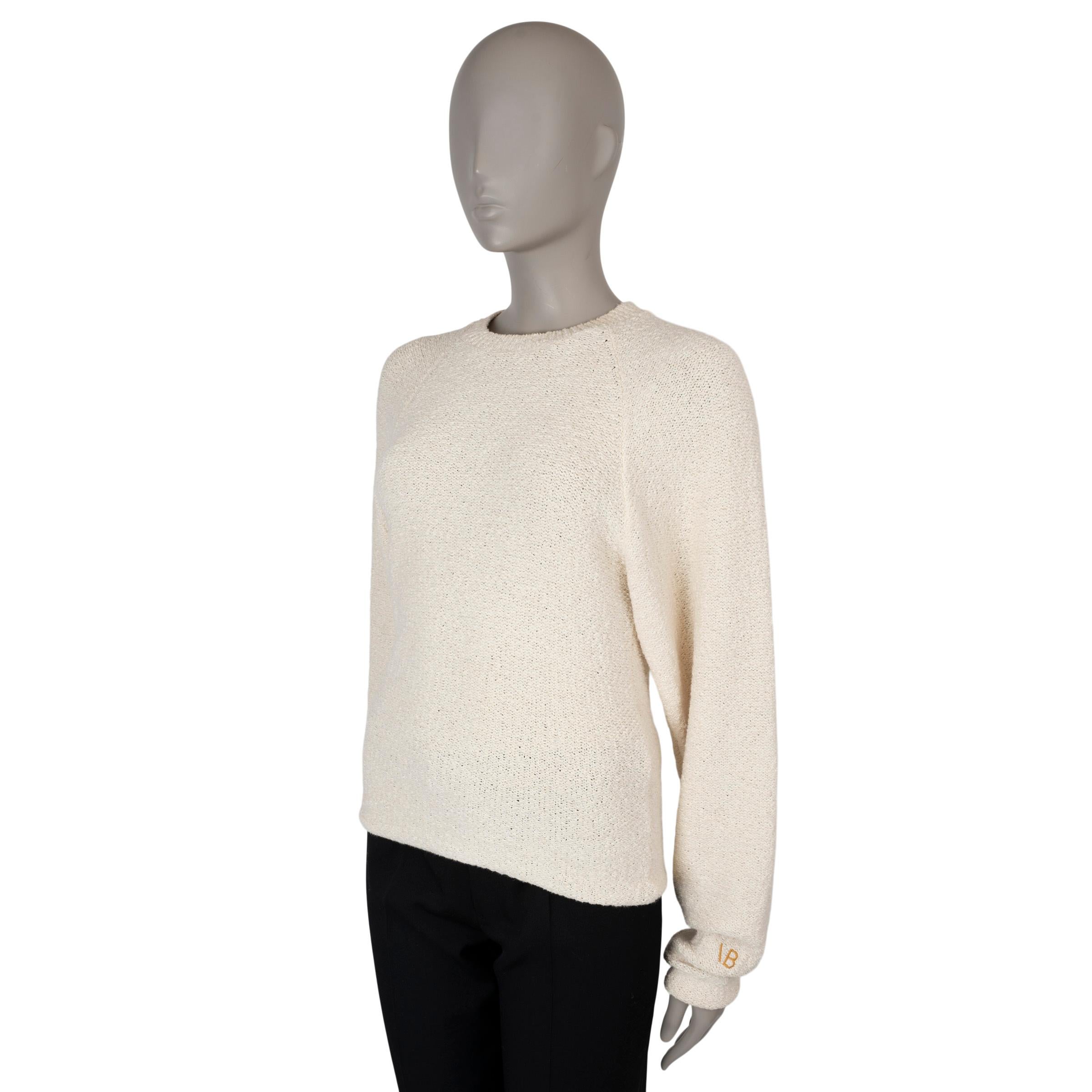 This 100% authentic Victoria Beckham sweater in cream bouclé knit is crafted from a blend of cotton (60%) and polyamide (40%), offering a soft, textured finish. It features a classic crewneck, raglan sleeves (measured from the neck), and straight