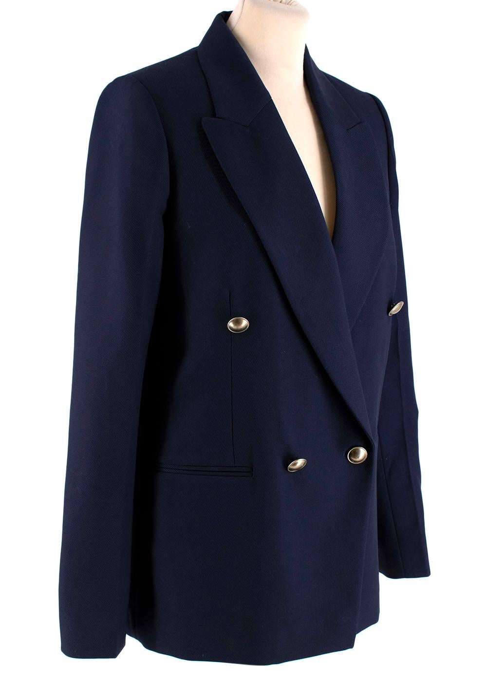 Victoria Beckham Double Breasted Navy Blazer

- Double-breasted gold button fastening
- Front welt pockets
- Vent-less back
- Partially lined

Materials: 
100% Wool
Lining - 100% Viscose
Lining 2 - 100% Cotton

Dry clean only
Made in Italy 

PLEASE