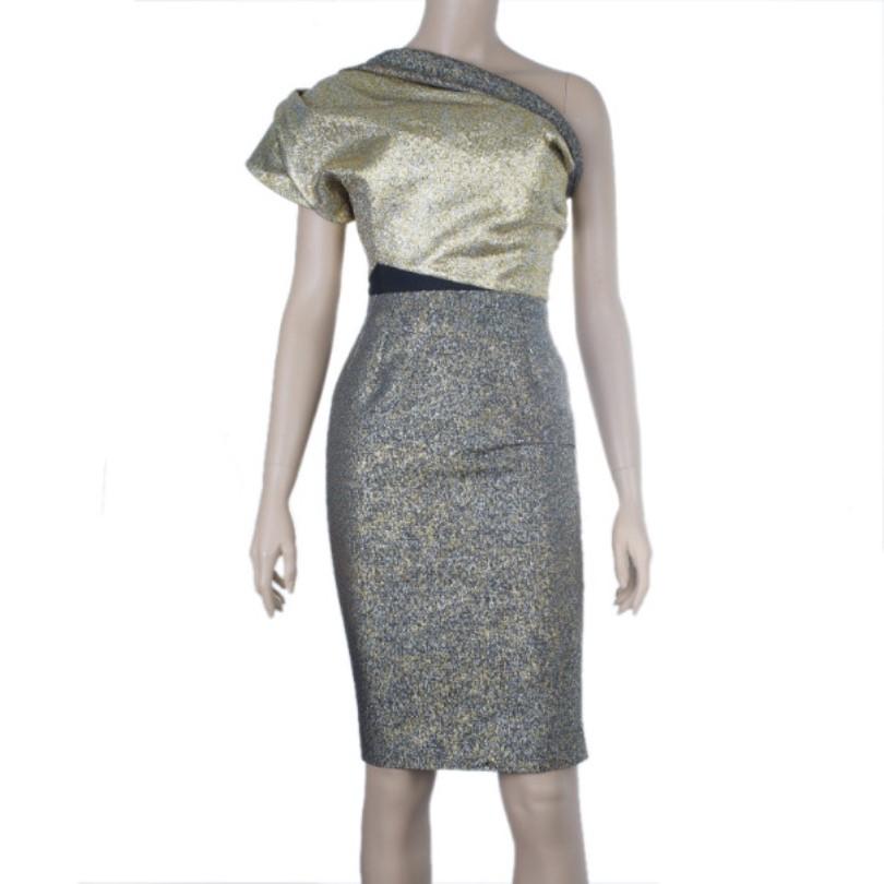 It's all glitz and glamour with this Victoria Beckham metallic cocktail dress. The one shoulder makes it subtly sexy, but also very chic. It features an almost hidden black band accounting the waist area, and was seen on celebrities like Dannii