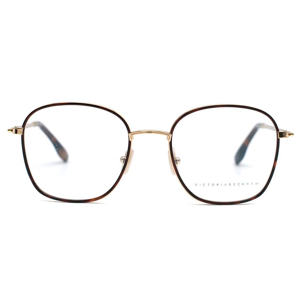 Victoria Beckham Fine Windsor Rim Square Optical Glasses

- deep square shape in gold metal
- Windsor rims
- ceramic nose pads which are etched with the VB monogram
- heat moulded temple tips for a comfortable fit

This item comes with the original