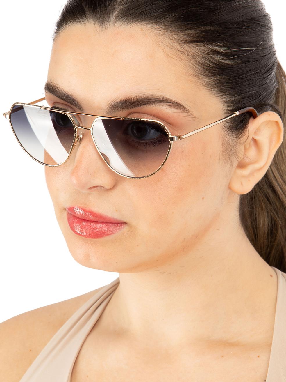 CONDITION is New with tags on this brand new Victoria Beckhamdesigner item. This item comes with original packaging.
 
 
 
 Details
 
 
 Model: VB221S 716
 
 Gold
 
 Metal
 
 Pilot Eye Sunglasses
 
 Gradient Blue Lens
 
 Branding at the arms
 
