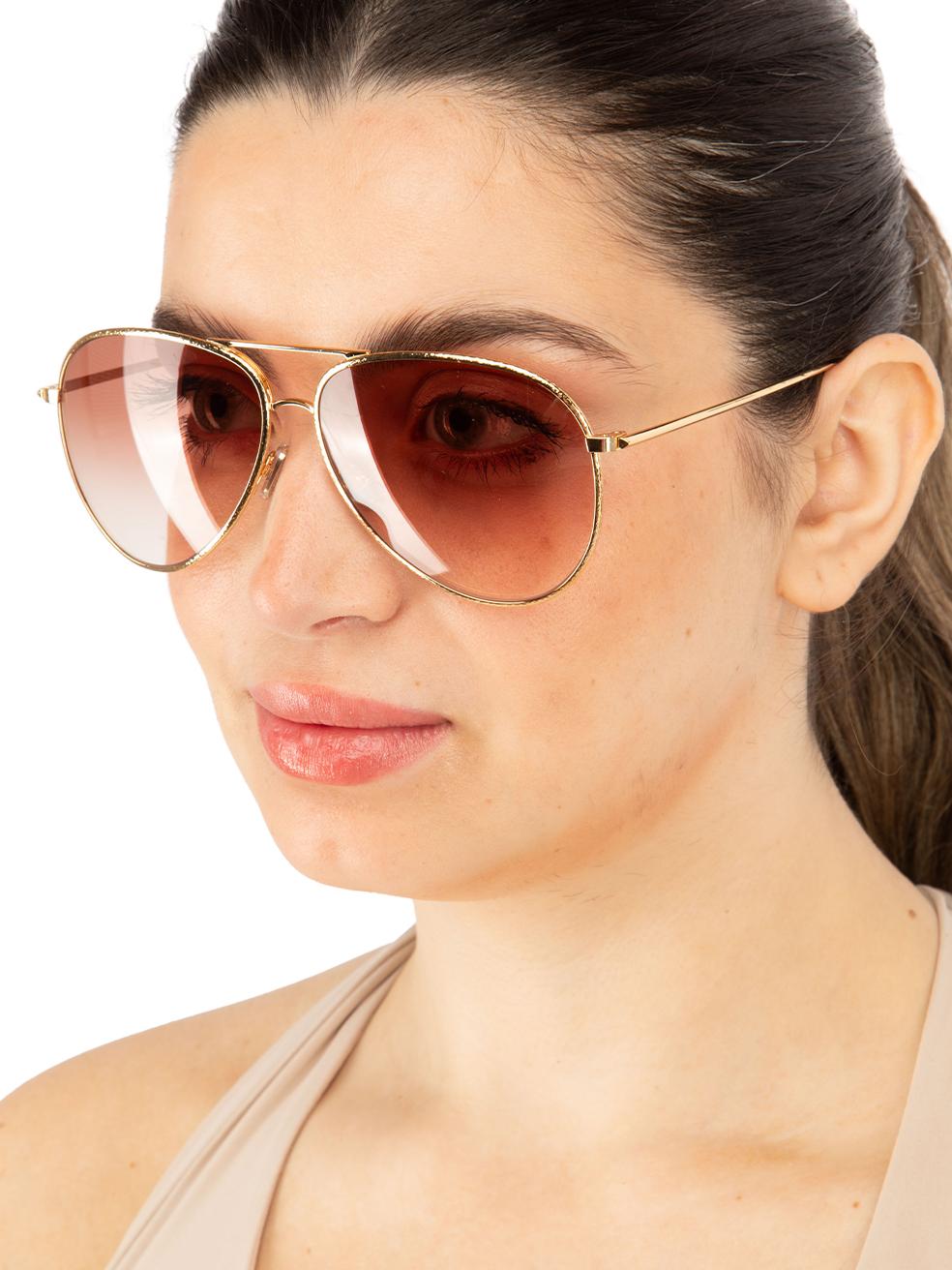 CONDITION is New with tags on this brand new Victoria Beckhamdesigner item. This item comes with original packaging.
 
 
 
 Details
 
 
 Model: VB203S 712
 
 Gold
 
 Metal
 
 Aviator Eye Sunglasses
 
 Gradient Burgundy Lens
 
 Branding at the arms
