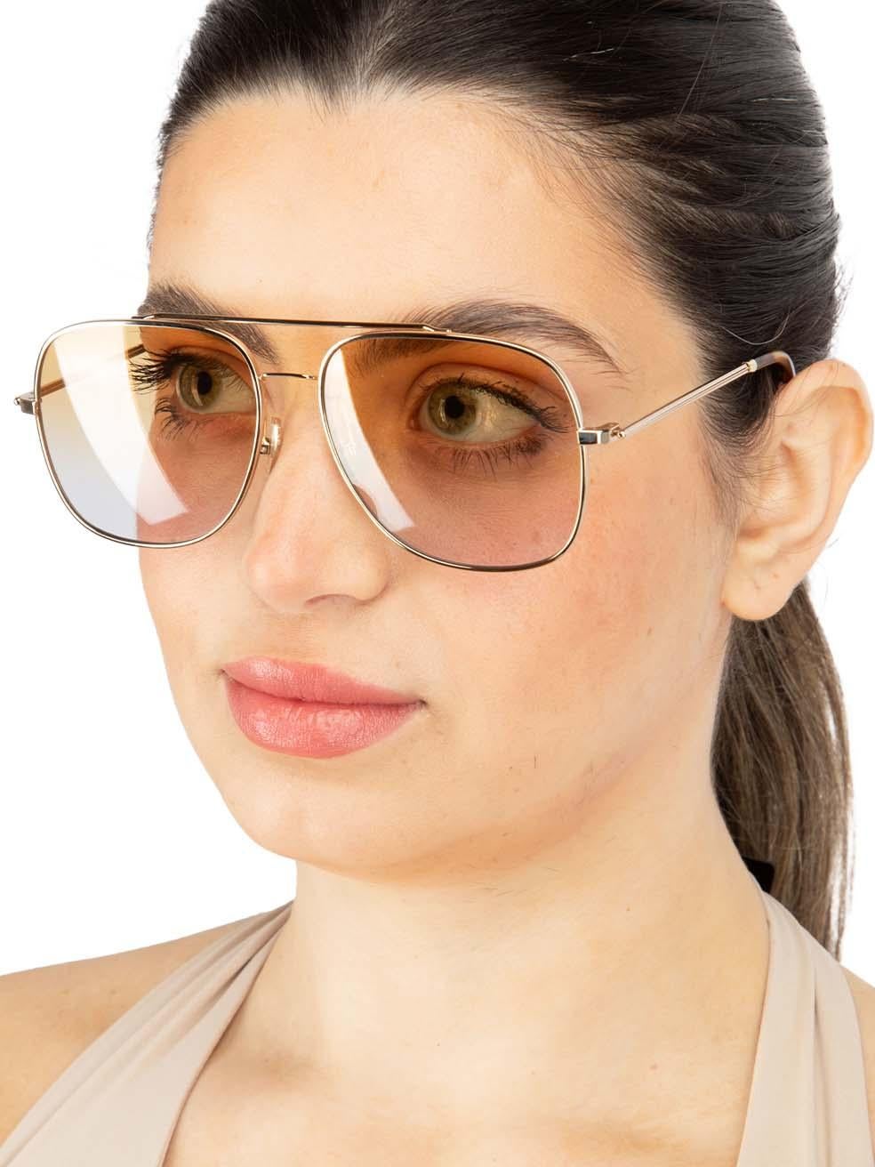 CONDITION is New with tags on this brand new Victoria Beckham designer item. This item comes with original packaging.
 
 
 
 Details
 
 
 Model: VB215S 723
 
 Gold
 
 Metal
 
 Pilot Square Eye Sunglasses
 
 Gradient Yellow Lens
 
 Branding at the