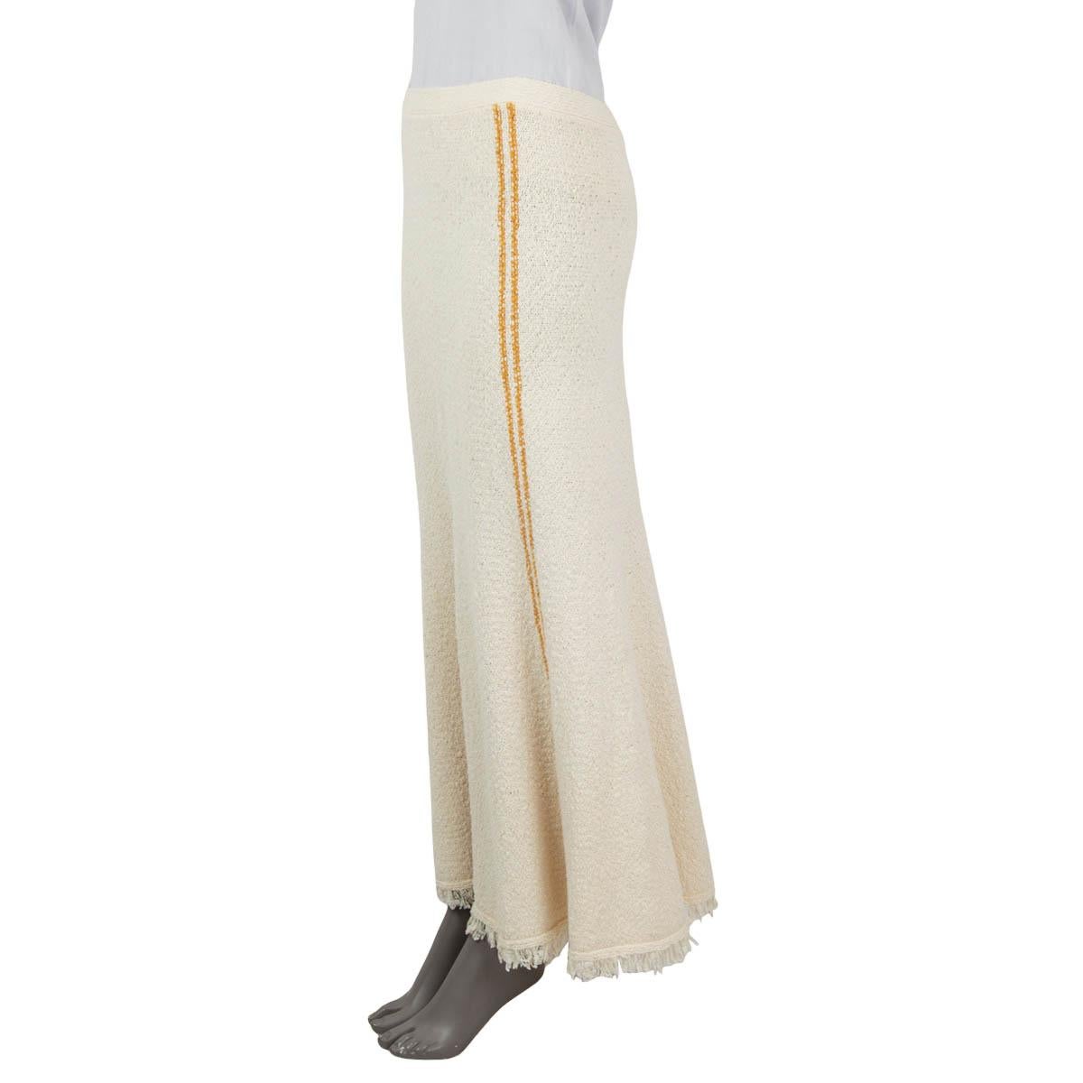 100% authentic Victoria Beckham bouclé-knit maxi skirt in ecru coloured cotton (60%) and polyamide (40%). Features an elasticated waist, mustard side stripes and a fringed hem. Has been worn and is in excellent condition.

Measurements
Tag