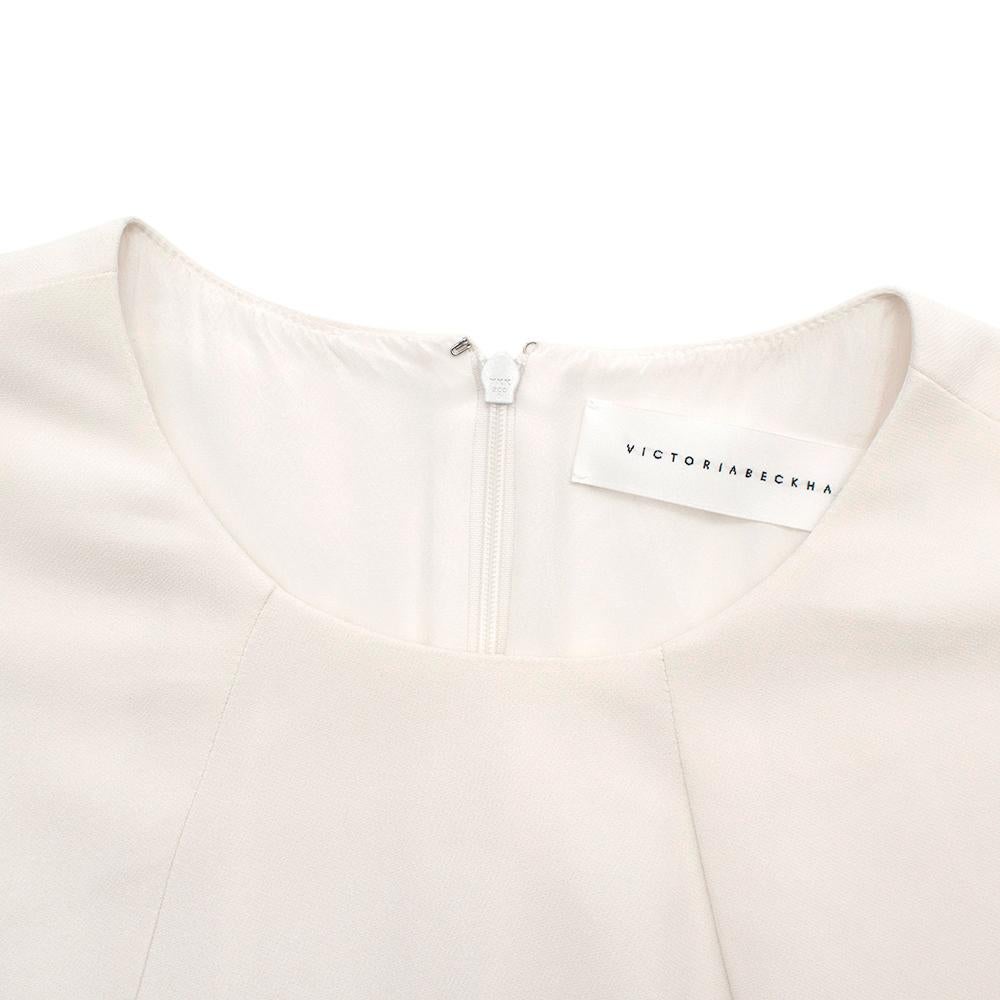 Victoria Beckham Ivory Crepe Blouse

- Gorgeous ivory colour
- Round neckline
- Concealed zipper down back
- Three-quarter length sleeves
- Classic, timeless design

Materials: 95% viscose, 5% elastane
Lining- 94% silk, 6% elastane

Made in