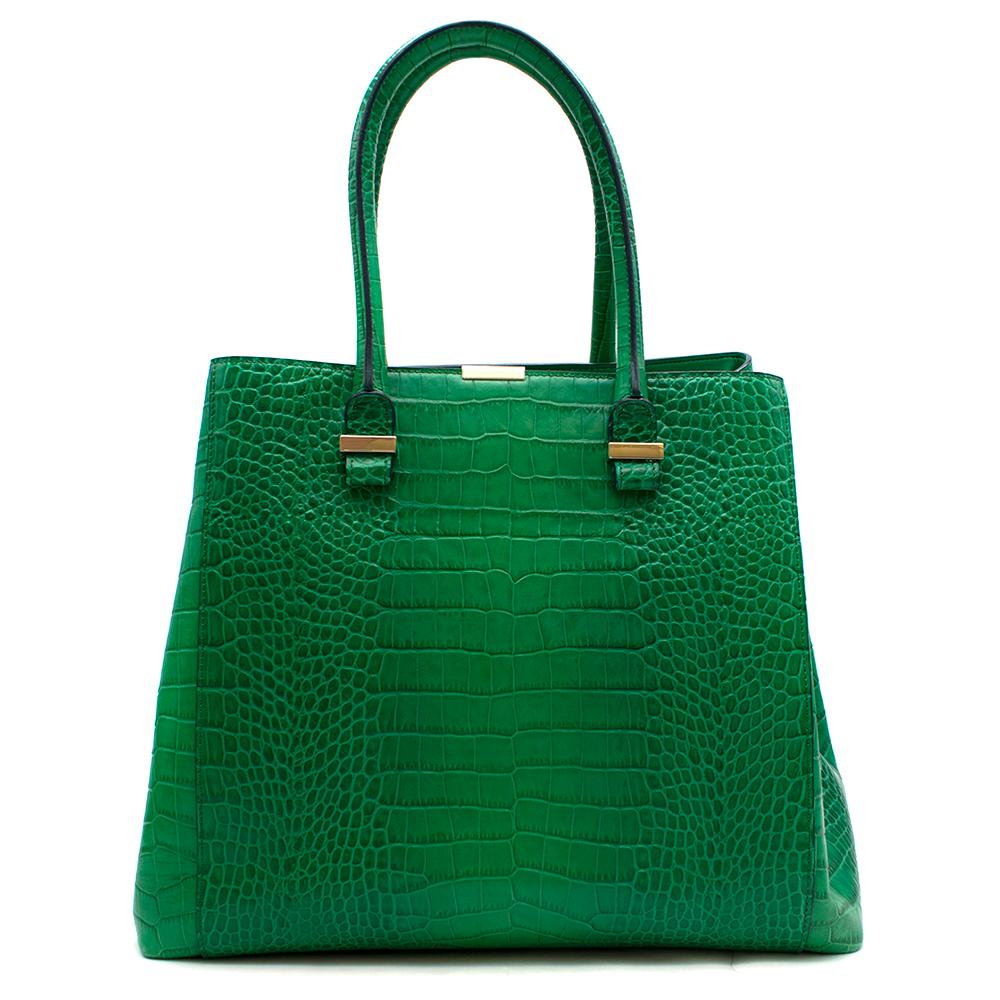 Victoria Beckham Liberty Emerald Crocodile-Effect Leather Tote

- Two top handles
- Embossed crocodile effect
- Designer plaque
- Gold-dipped hardware
- Internal zipped pocket
- Slip pocket 
- Canvas lining
- Tab fastening at open top
Comes with a