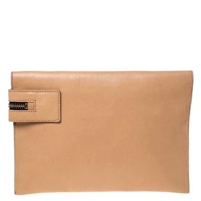Made of leather, this clutch from Victoria Beckham is a creation worthy of being yours. It is designed in a shade of peach orange and has a zipper that leads to a canvas-lined interior. The pouch is well-made and handy.

Includes: The Luxury Closet