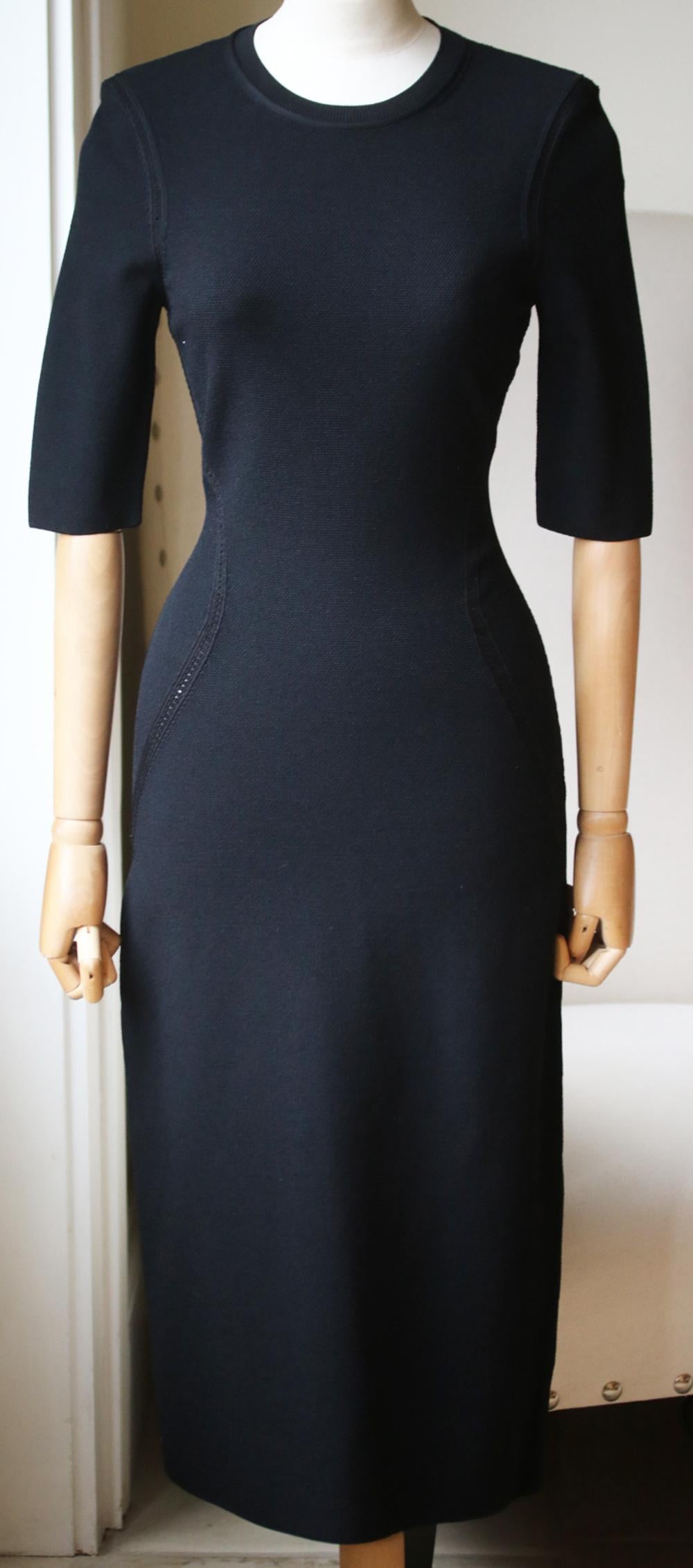 Made in Italy, this stretch-knit piece has a sculpting and smoothing effect, and is designed with a pointelle finish to subtly trace an hourglass silhouette. Black stretch-knit. Slips on. 78% Viscose, 15% polyester, 7% elastane. Made in Italy.