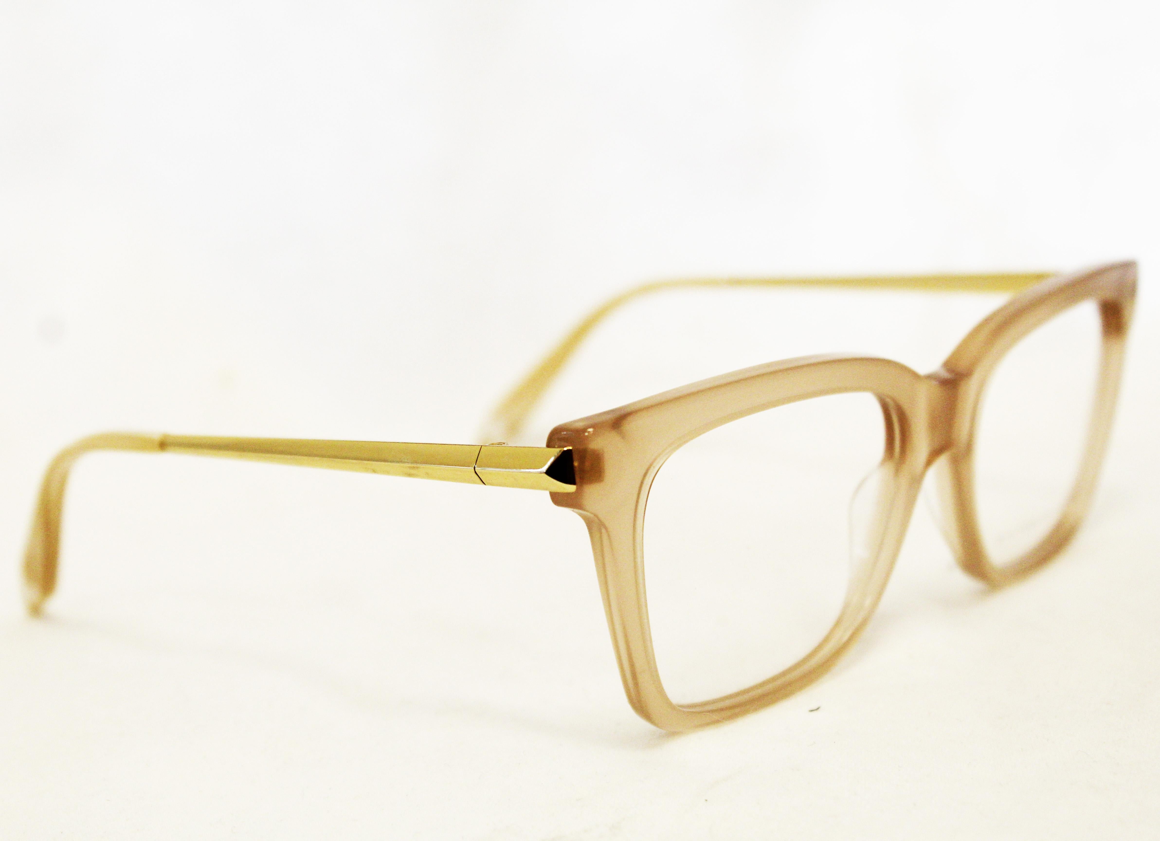 Victoria Beckham square Victoria VBOPT205 C03 Milky taupe color contains gold tone and taupe temples.  These glasses are modern and current, the lenses can be set to your own prescription in plain glass or sunglasses.  Glasses in excellent