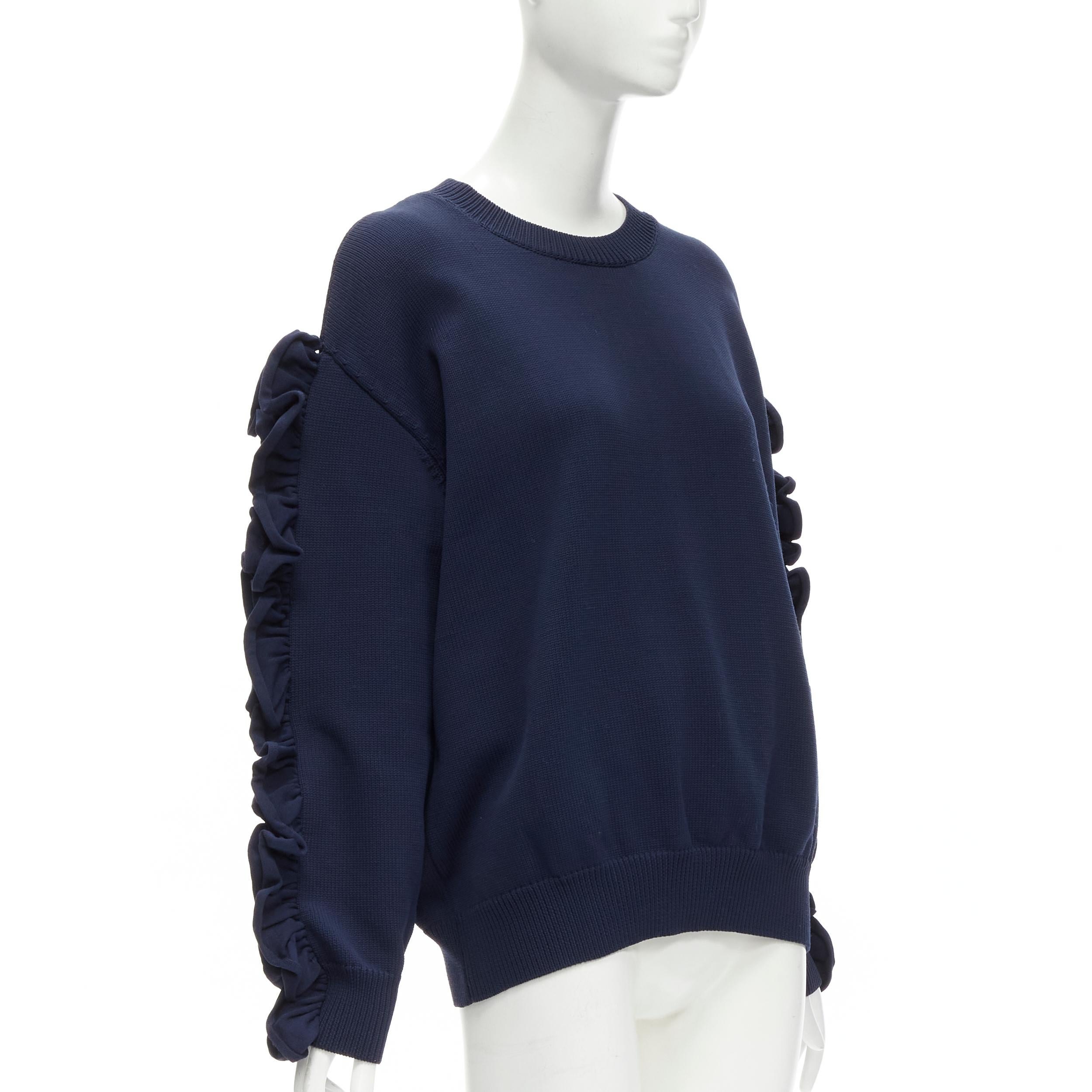 VICTORIA BECKHAM VVB navy blue ruffle sleeve pullover crew sweatshirt UK12 L
Reference: GIYG/A00257
Brand: VVB Victoria Beckham
Designer: Victoria Beckham
Material: Nylon
Color: Blue
Pattern: Solid
Closure: Pullover
Made in: