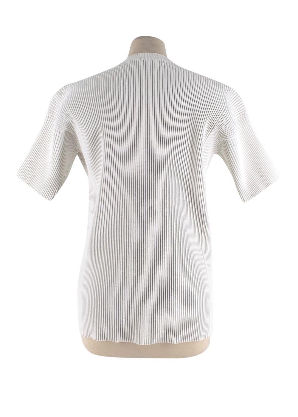 Victoria Beckham White Ribbed Top

- Ribbed stretchy texture 
- Short sleeves
- Mid weight material
- Round neck with extra ribbing
- Exposed edges
- Spring Summer 2015
- Straight cut

Fabric Composition:

78% Viscose
16% polyester
5% Polyamide
1%