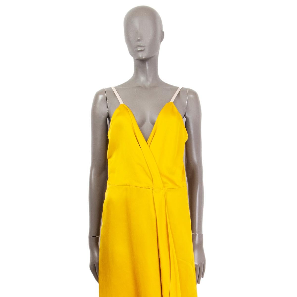 Victoria Beckham draped spaghetti-strap satin dress in yellow silk (52%) and viscose (48%) with a pleated deep v-neck front. Has been worn and is in excellent condition. 

Tag Size 12
Size M
Bust 90cm (35.1in)
Waist 76cm (29.6in)
Hips 100cm