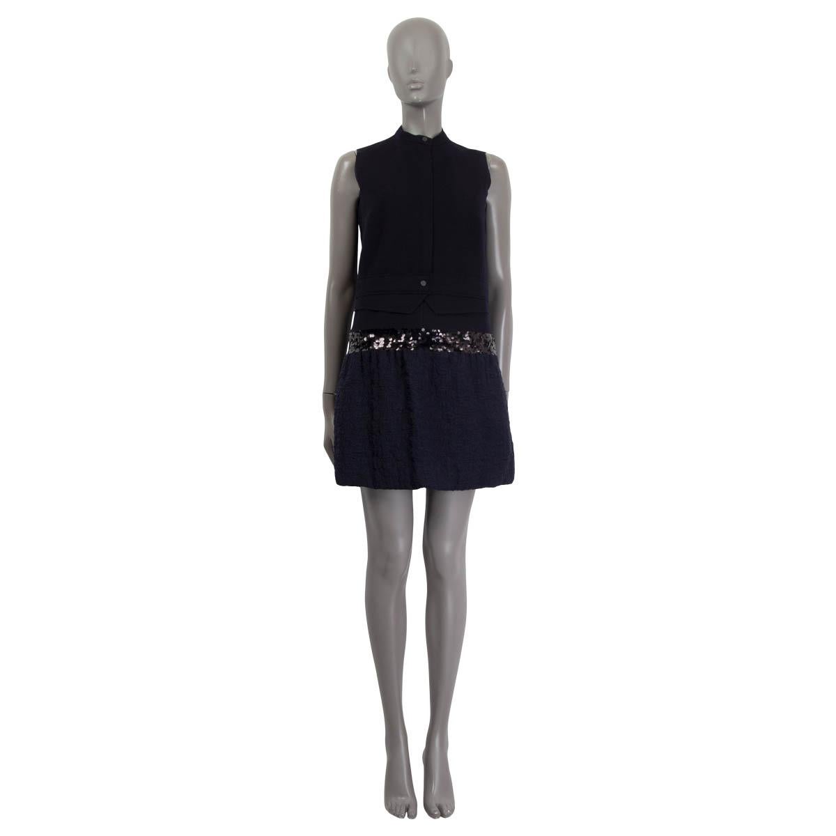 100% authentic Victoria Victoria Beckham sleeveless dress in navy blue wool and nylon. Features sequin embellishments and a flared skirt. Opens with a zipper and a button on the front and a zipper on the side. Lined in navy blue polyester (65%) and