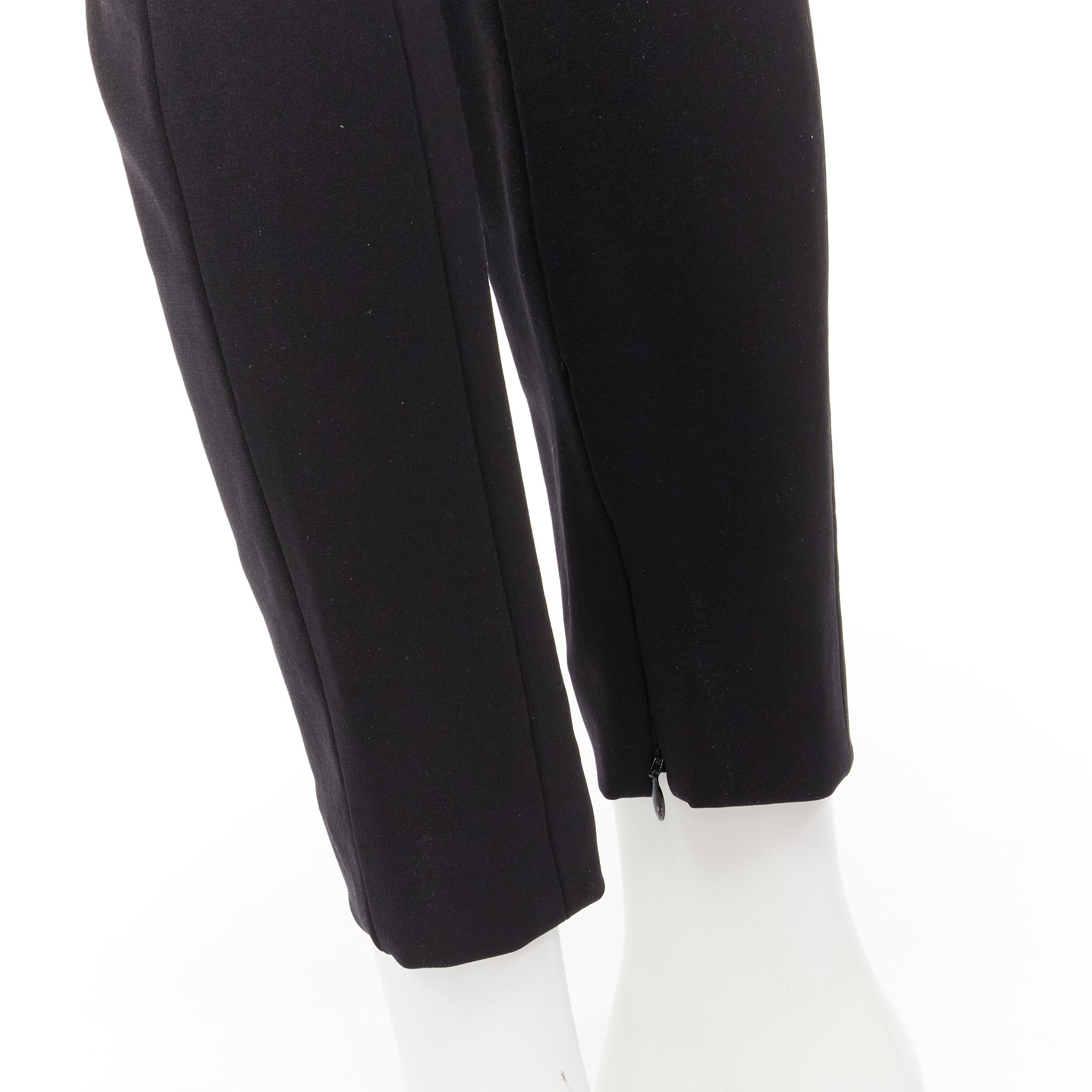 VICTORIA BEKHAM black stiff structured heavy fabric skinny pants UK10 M 
Reference: KEDG/A00103 
Brand: Victoria Beckham 
Material: Nylon 
Color: Black 
Pattern: Solid 
Closure: Zip 
Extra Detail: 4-pocket. Zipped at hem. 
Made in: Italy