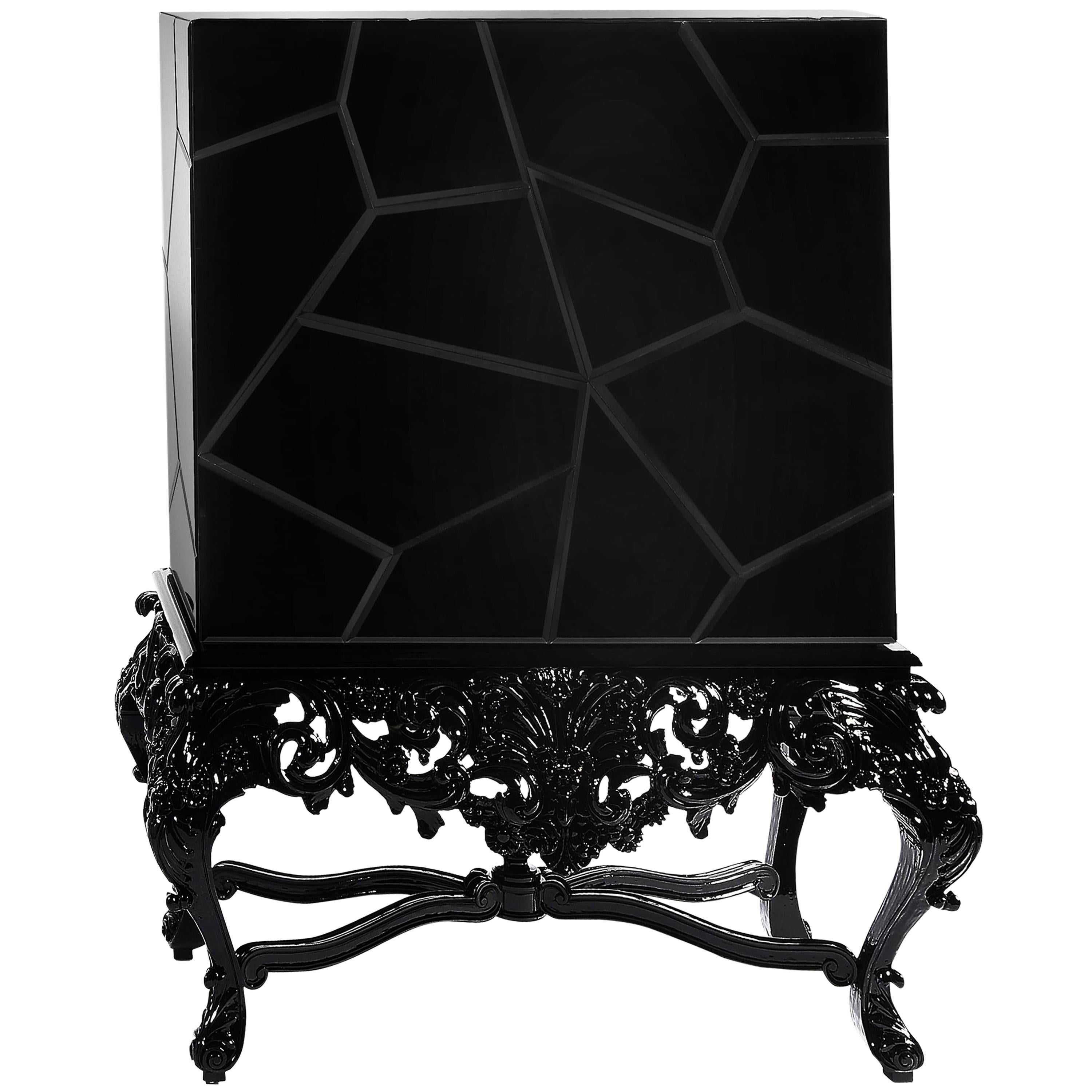 The Victoria Cabinet is a modern take on Victorian style, a play between old and new with an unpredictable pop of color. With a mahogany-crafted structure and coated in a sleek black lacquered beveled glass, it features a pair of overlay doors whose