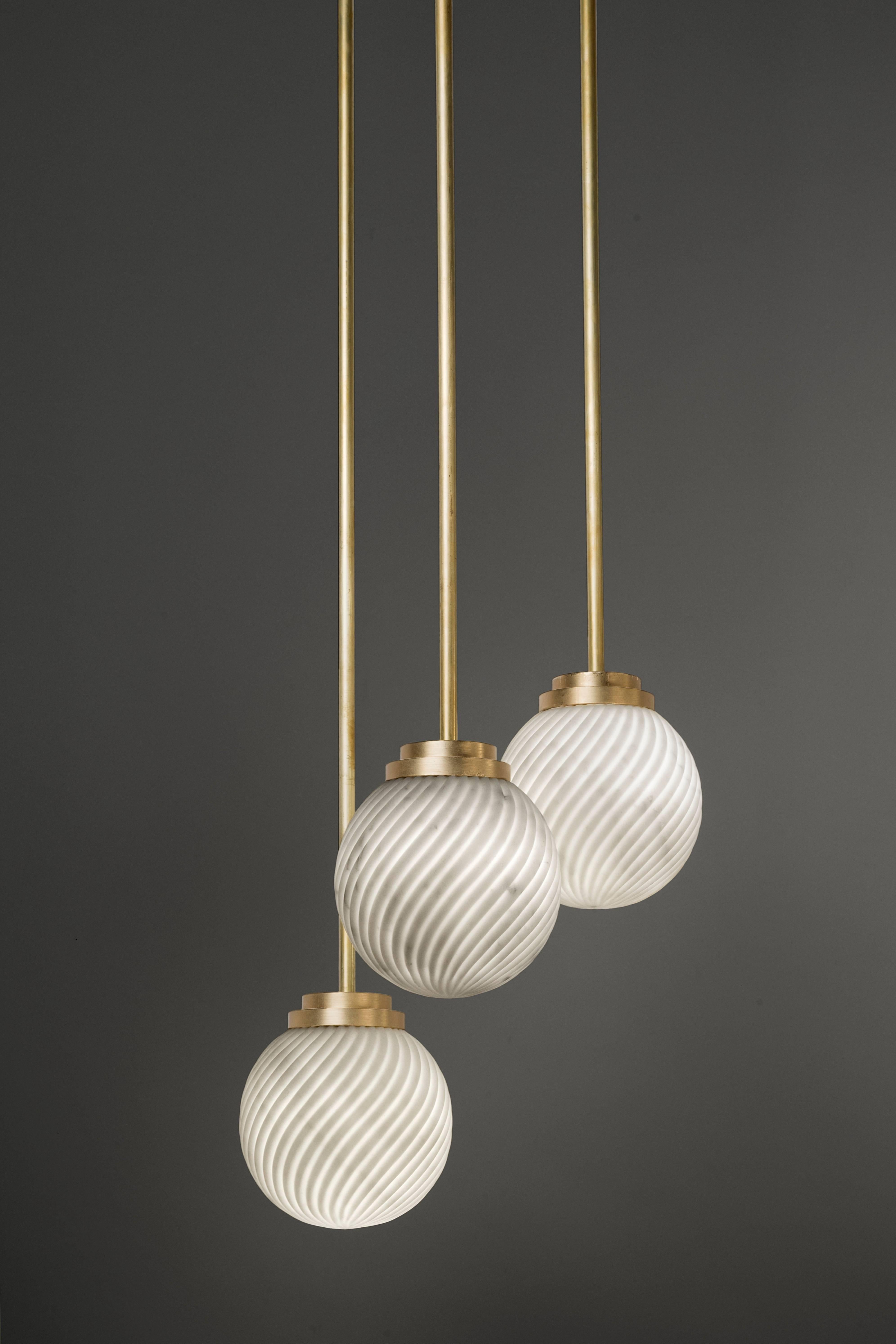 Victoria lighting celebrates the delicacy of Arabescato marble and brushed brass, protagonists of the iconic Victoria tea set. The collection is handmade in Italy and comprises a table lamp, a wall lamp, a pedant light and a chandelier of three