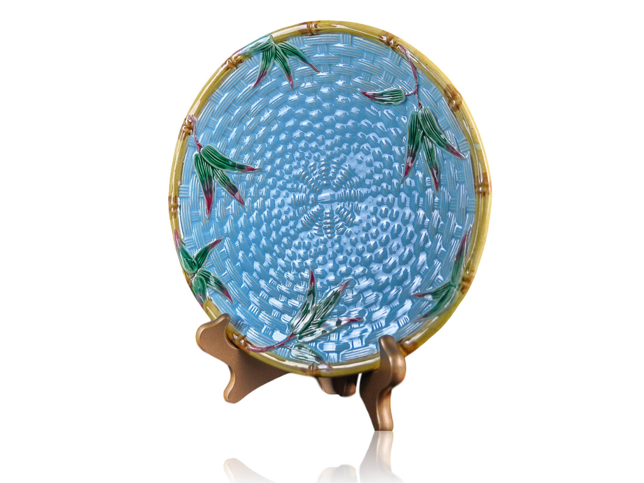 Victoria Pottery (VPC) Majolica plate 8.75-ins, English, circa 1875, with simulated bamboo edging, colorful bamboo shoots, on a vivid turquoise basket-weave ground. VPC painted pattern mark 'M110' to reverse.
Provenance: From the Estate of Mrs. John
