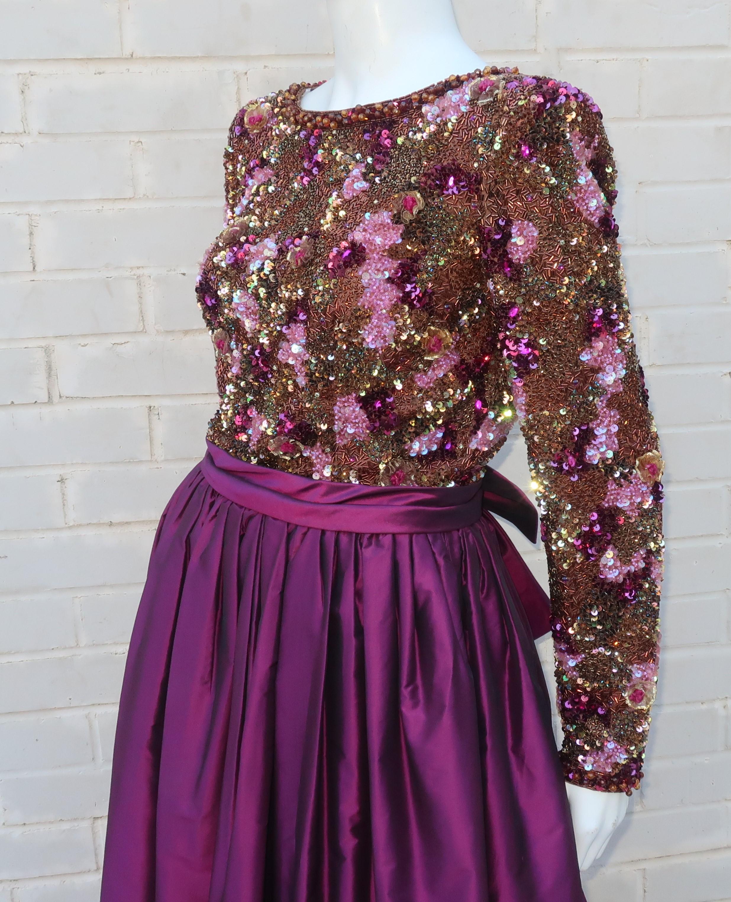 Magical magenta!  The fully embellished bodice on this C.1980 Victoria Royal dress is an amazing design of well placed sequins, beads and tulle rosettes.  The voluminous dark magenta silk taffeta skirt is the perfect compliment to the shades of