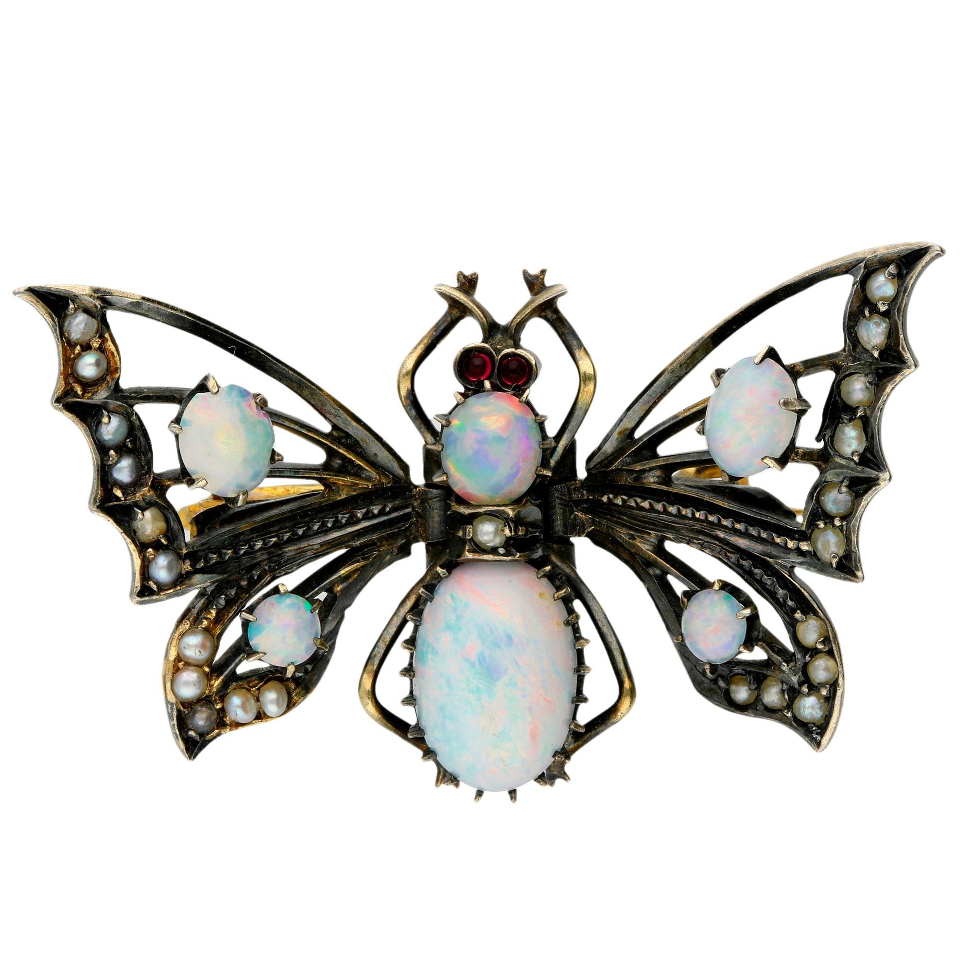 This beautiful butter fly brooch, with delicious opal highlights, to the beautifully crafted openwork wings, enhanced by the gorgeous split pearl trim.

A lovely gift for an October birthday.

SPECIFICATION
Weight (grams)	6.10
Fineness	Fine