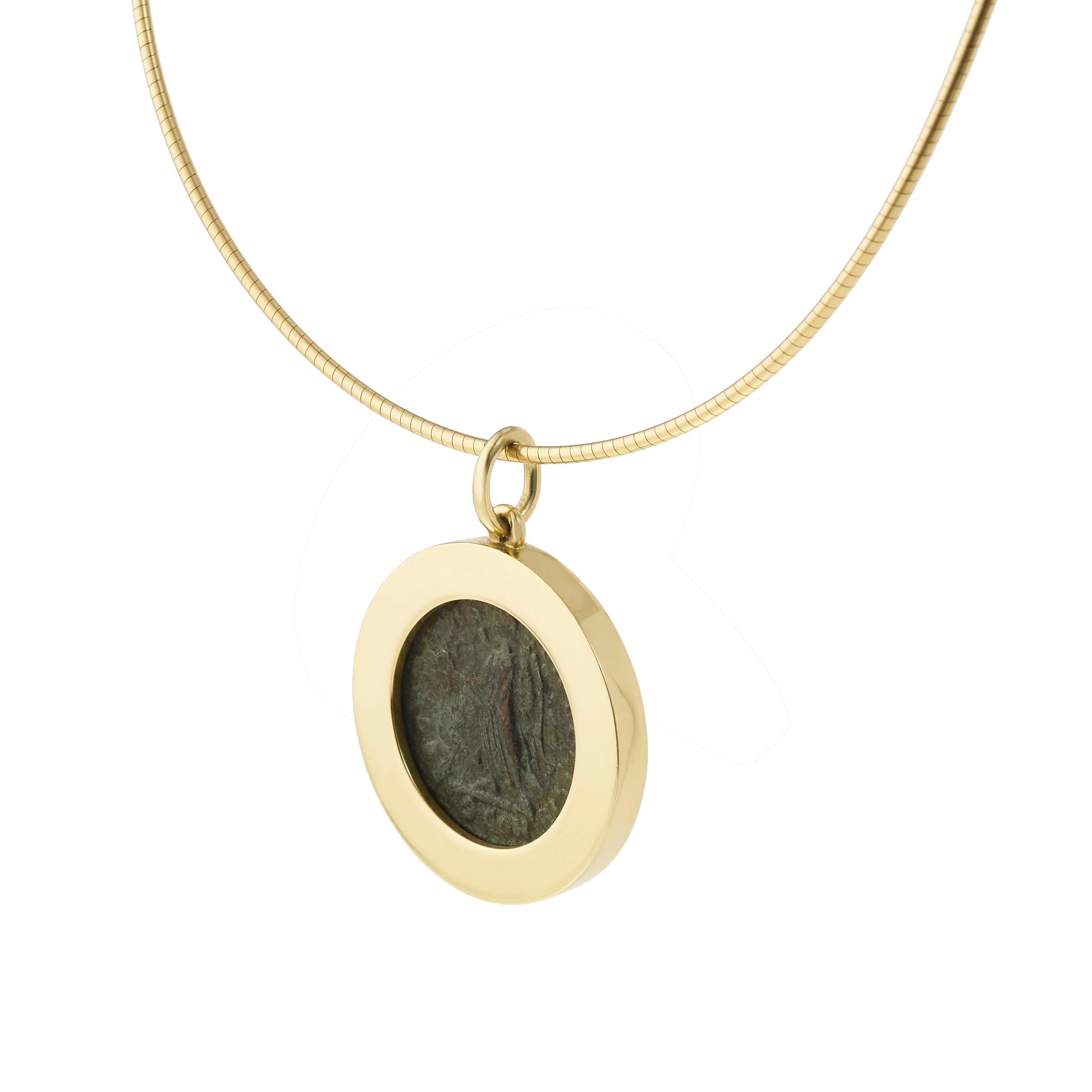 Victoria Strigini (b. 1991) 

A contemporary 18k yellow gold pendant necklace featuring an ancient Roman bronze coin from 364 AD. The classical bronze depicts the Roman emperor Valens (reigned 364 - 378) on the front and a Victory on the reverse.
