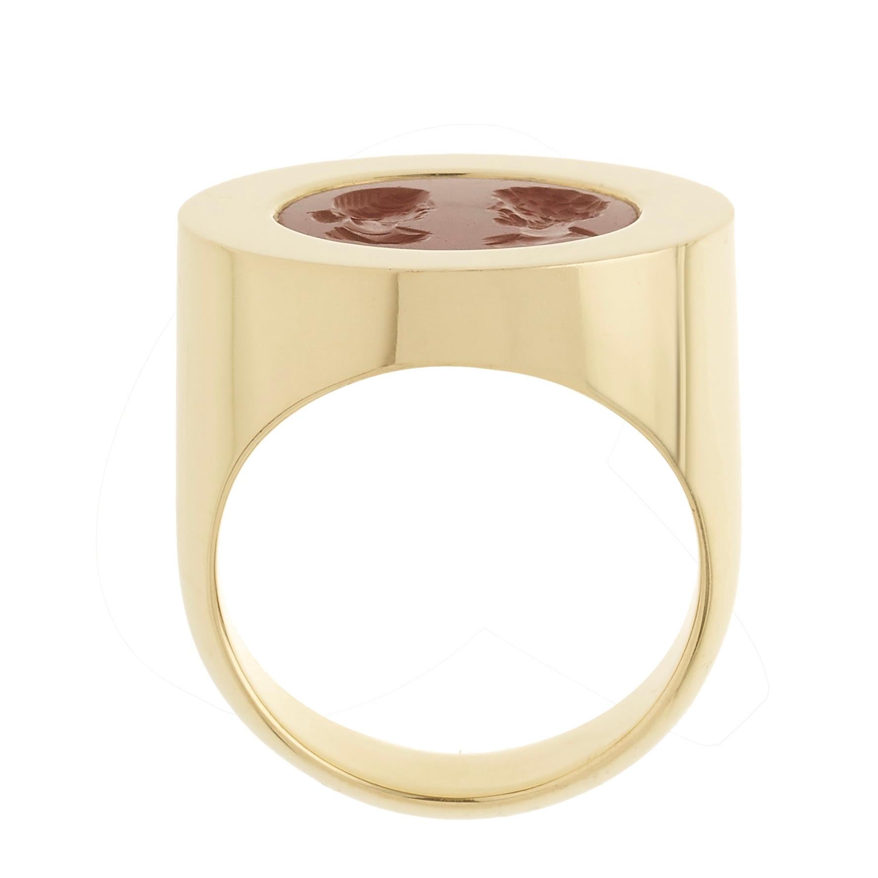 Victoria Strigini (b. 1991) 

A deep-set, thick-bezel, handcrafted contemporary wedding or engagement ring by Victoria Strigini, in 18k yellow gold with a high-shine finish, featuring a Roman intaglio from the 2nd - 3rd century AD, in jasper. The
