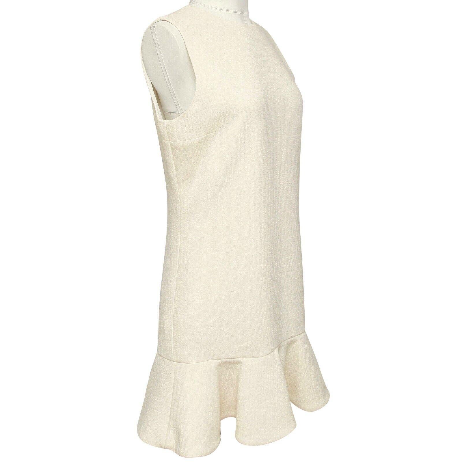 GUARANTEED AUTHENTIC VICTORIA VICTORIA BECKHAM IVORY FLARED SLEEVELESS DRESS


Design:
- Lovely ivory sleeveless dress.
- Crew neck.
- Flared hem.
- Concealed back zipper.
- Beautiful, lightweight year round.
- Lined.

Size: M, Tag Removed, Refer to