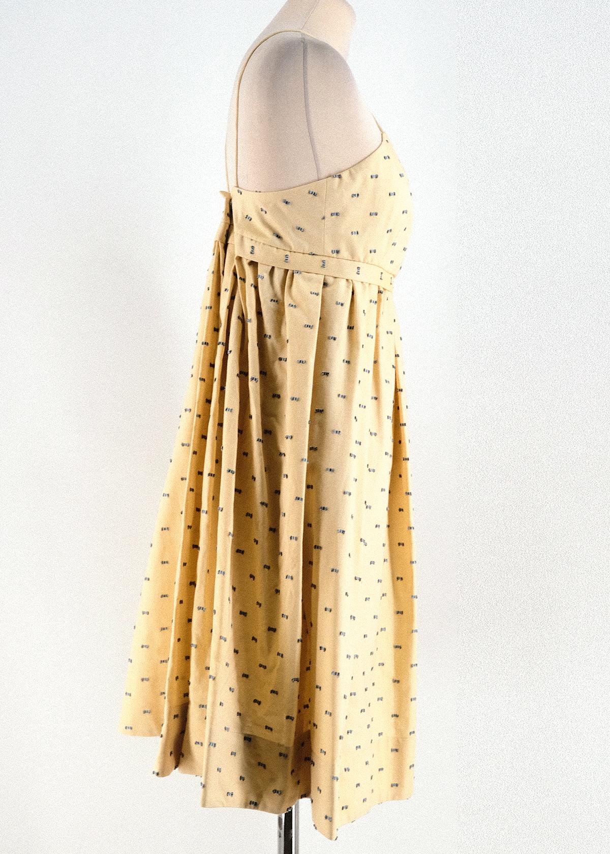Victoria Victoria Beckham Pale Yellow Fils Coupe Dress

- Pale Yellow Fils Coupe Dress
- 100% Cotton
- Cross Spaghetti Straps 
- Box Pleated Empire Waist 
- Push button fastening at back

Please note, these items are pre-owned and may show some