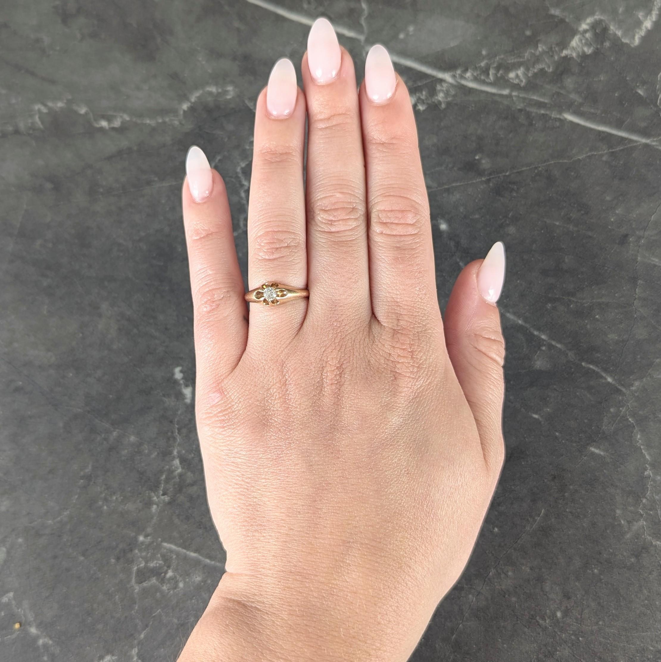 Centering an old mine cut diamond weighing approximately 0.18 carat - H color with VS2 clarity
Set with belcher-style prongs forming a buttercup motif
Flanked by rounded shoulders with high polished finish
Stamped for 14 karat gold
With maker's
