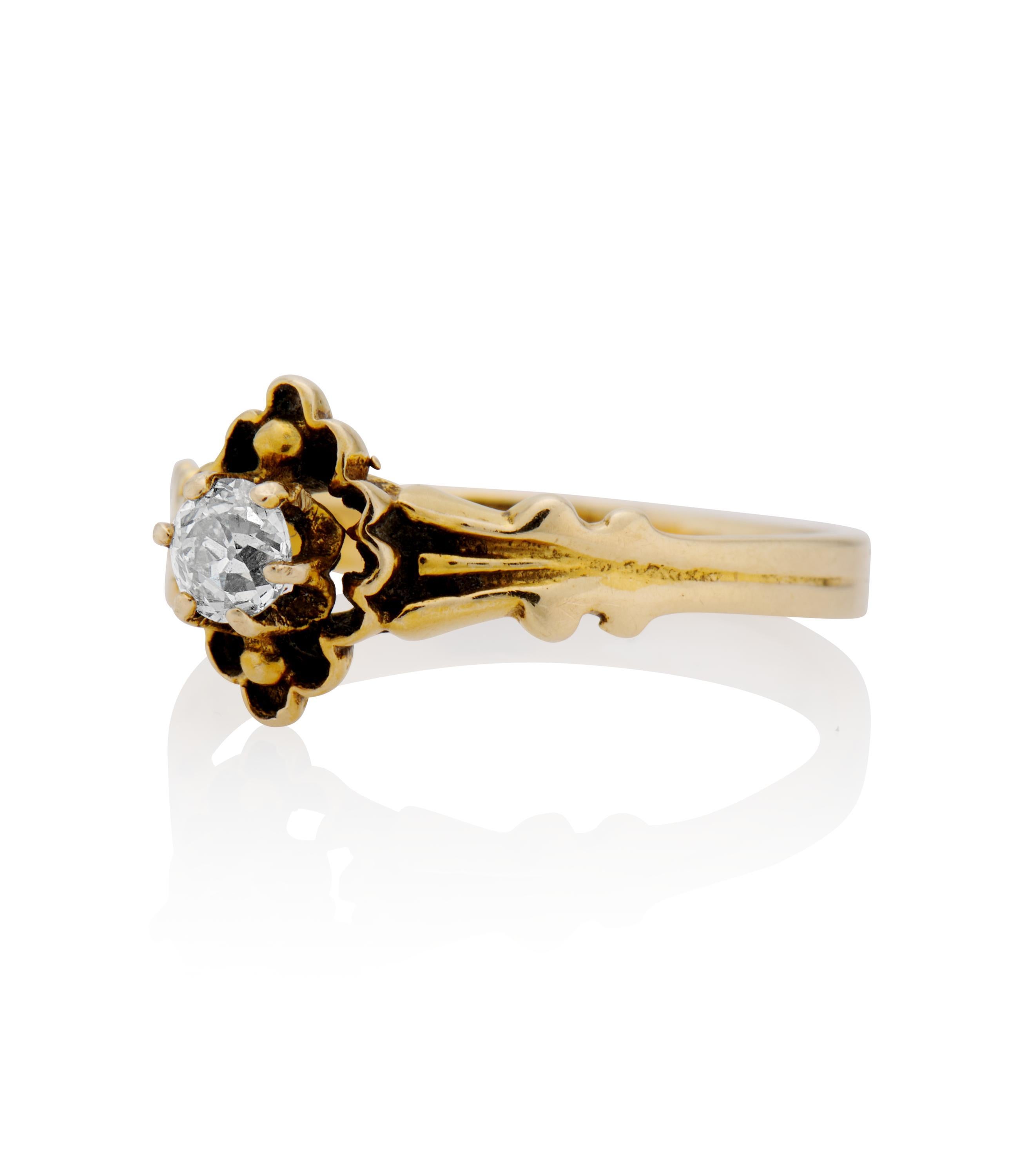 Description 
Antique Victorian engagement ring centered with a 0.23 carat Round cut diamond within a carved 18k yellow gold setting. A unique style from the Victorian era with plenty of finger coverage.
SKU #R3587
18k yellow gold
Measurements: