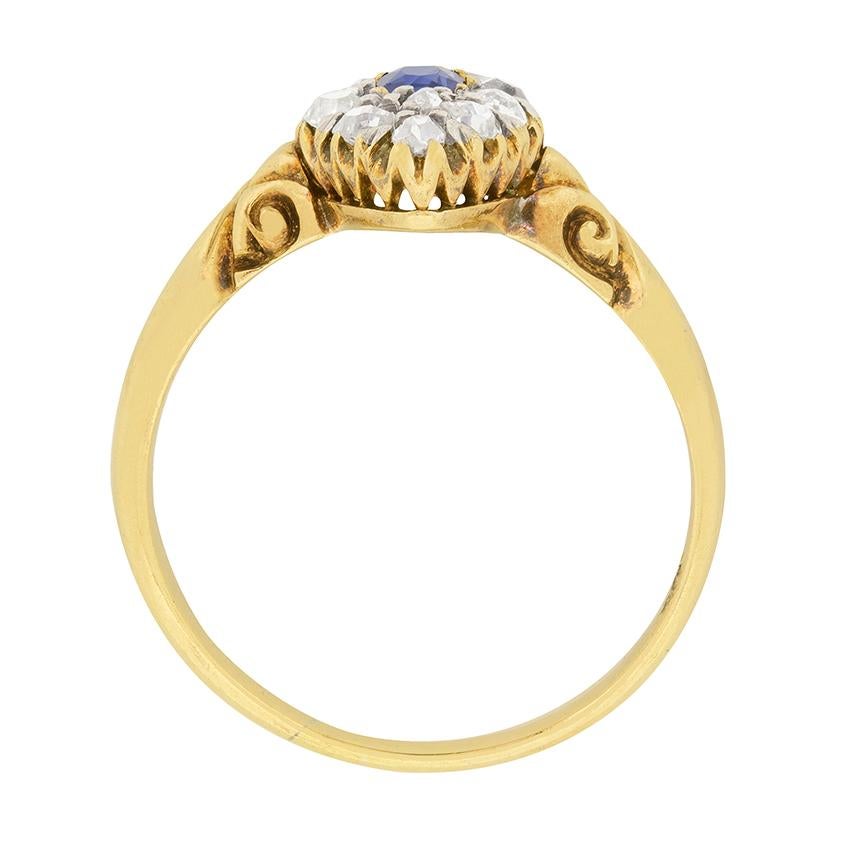 This lovely Victorian cluster ring features a blue sapphire and diamonds. The oval cut sapphire is 0.30 carats. Surrounding the sapphire are 0.70 carats of old cut diamonds. They are H colour and SI clarity. The stones are set in 18 carat yellow