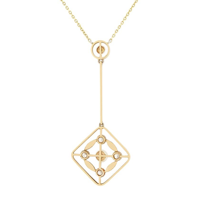 Dating to the early 1900s, this delightful drop pendant is adorned with pearls and diamonds. Set into 15 carat white gold, a 2.5mm pearl sits at the top of the drop with a larger 3.5mm pearl at the bottom, surrounded by four diamonds, one on each of
