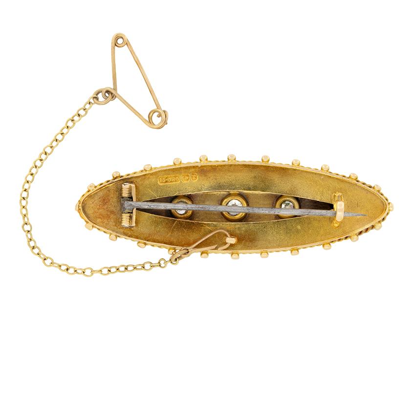 This wonderful diamond set brooch was hand crafted during the Victorian era. Made entirely in 15 carat yellow gold the brooch features a trio of old cut diamonds grain set within three carved stars. The central diamond is the largest at 0.20 carat