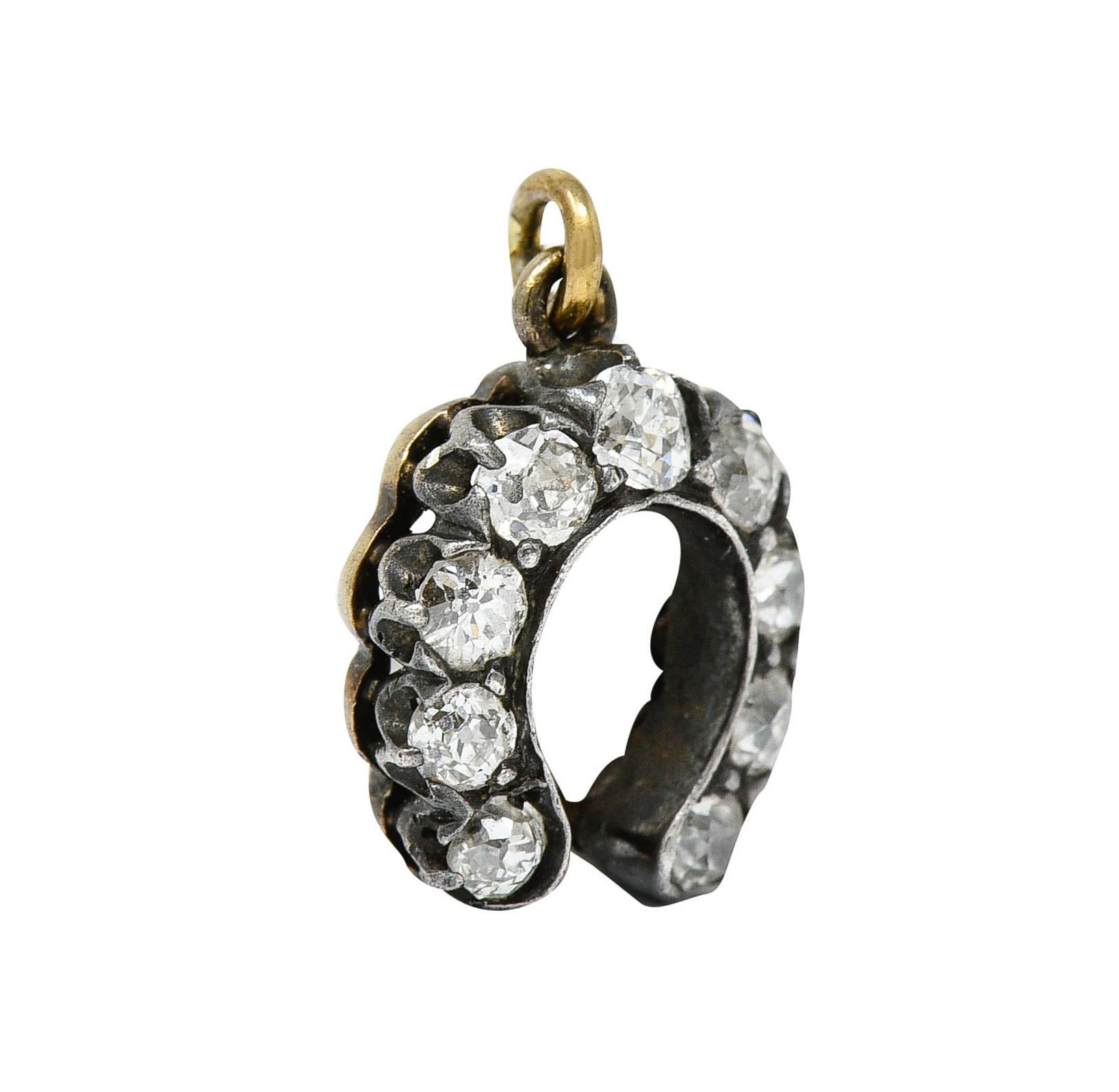 Charm is designed as a silver-topped horseshoe

Comprised of prong set old mine cut diamonds

Weighing in total approximately 0.50 carat - quality consistent with age

Tested as silver-topped 18 karat gold

Circa: 1900

Measures: 3/8 x 1/2