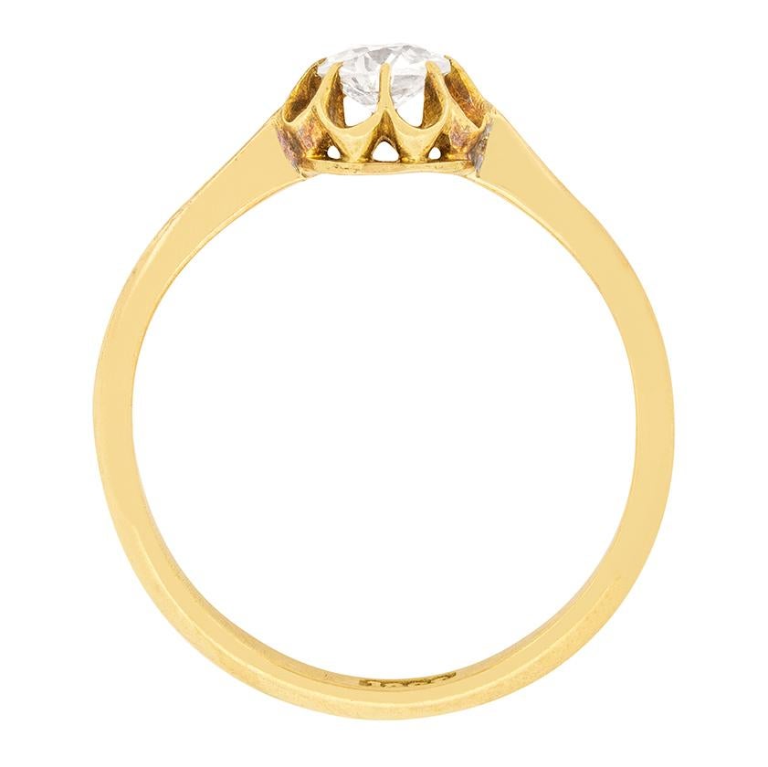 A gorgeous old cut diamond is the centre of this Victorian era engagement ring. The diamond is 0.50 carat, and is a G colour and VS2 clarity. It is held within 18 carat yellow gold claws in an illusion style setting, designed to enhance the size of
