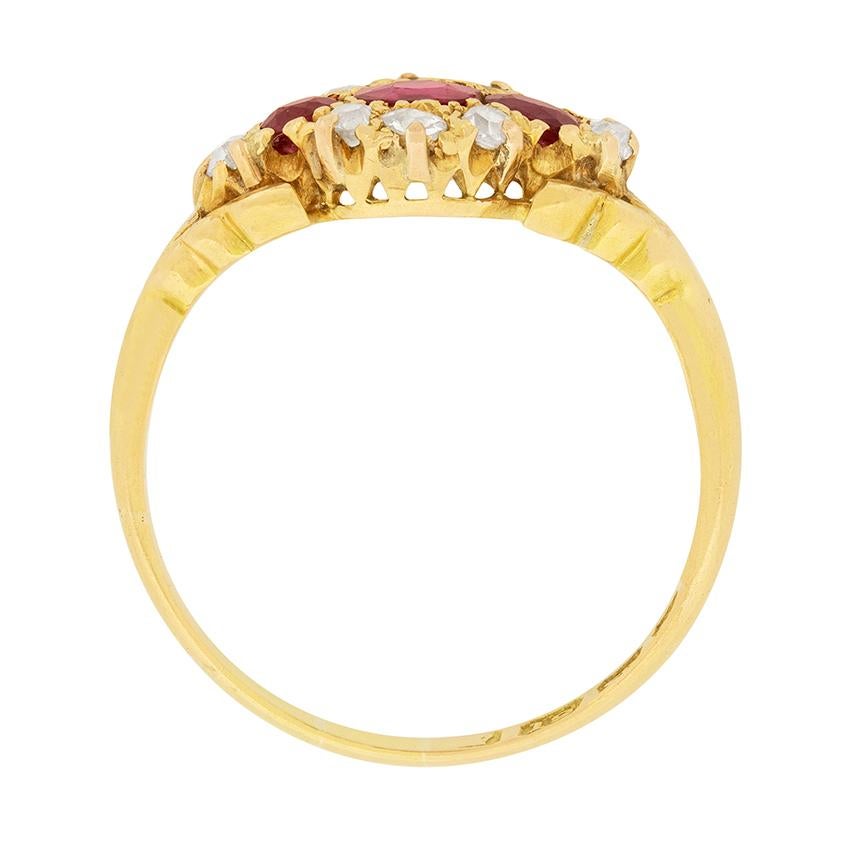 This stunning Victorian ring is hallmarked from the year 1900. Rubies and diamonds sparkle in the 18 carat yellow gold. The centre ruby is 0.25 carat, and the rubies to either side are 0.15 carat each. A total of 0.18 carat of old cut diamonds are