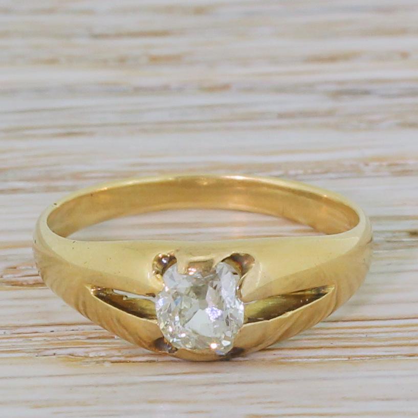 A classic Victorian diamond solitaire ring. The cushion shaped old mine cut diamond nestles nice and low to the finger in a sleekly crafted solitaire setting. A wonderful everyday style that suits both men and women.

Accompanied by an independent