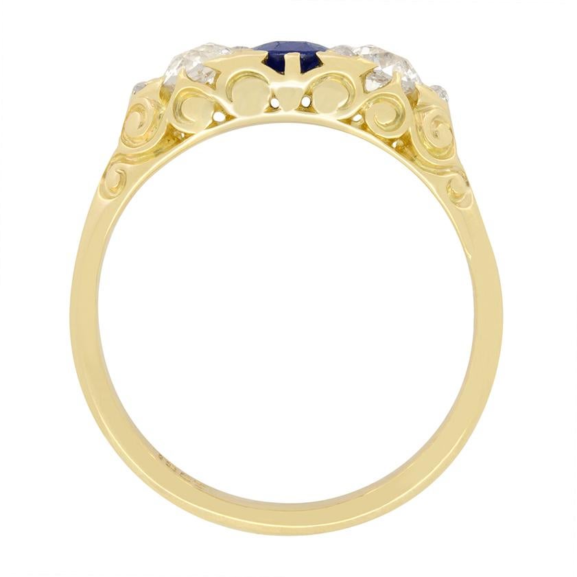 Dating back to the 1880s, this stunningly hand crafted Victorian ring features a 0.60 carat oval cut sapphire at the centre, flanked by a pair of old cut diamonds. The diamonds are 0.35 carat a piece and match in quality at G in colour and VS2 in