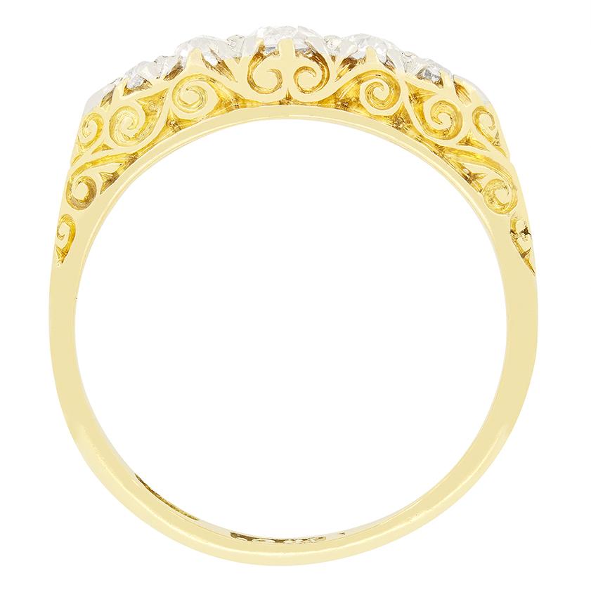 This elegant Victorian ring features five glistening old cut diamonds gentle tapered from the centre out. The largest central diamond is 0.25 carat, with the flanking pair weighing 0.15 carat each and the two end stones are 0.05 carat a piece. All
