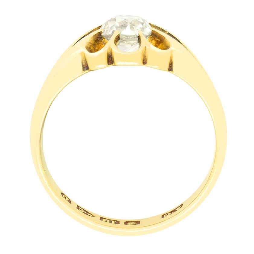 Centring around a 0.65 carat old oval cut diamond this charming ring has original Chester hallmarks dating it to 1887. The diamond is of light fancy yellow gold and has a clarity of VS2. The stone is claw set into 18 carat yellow gold with a chunky