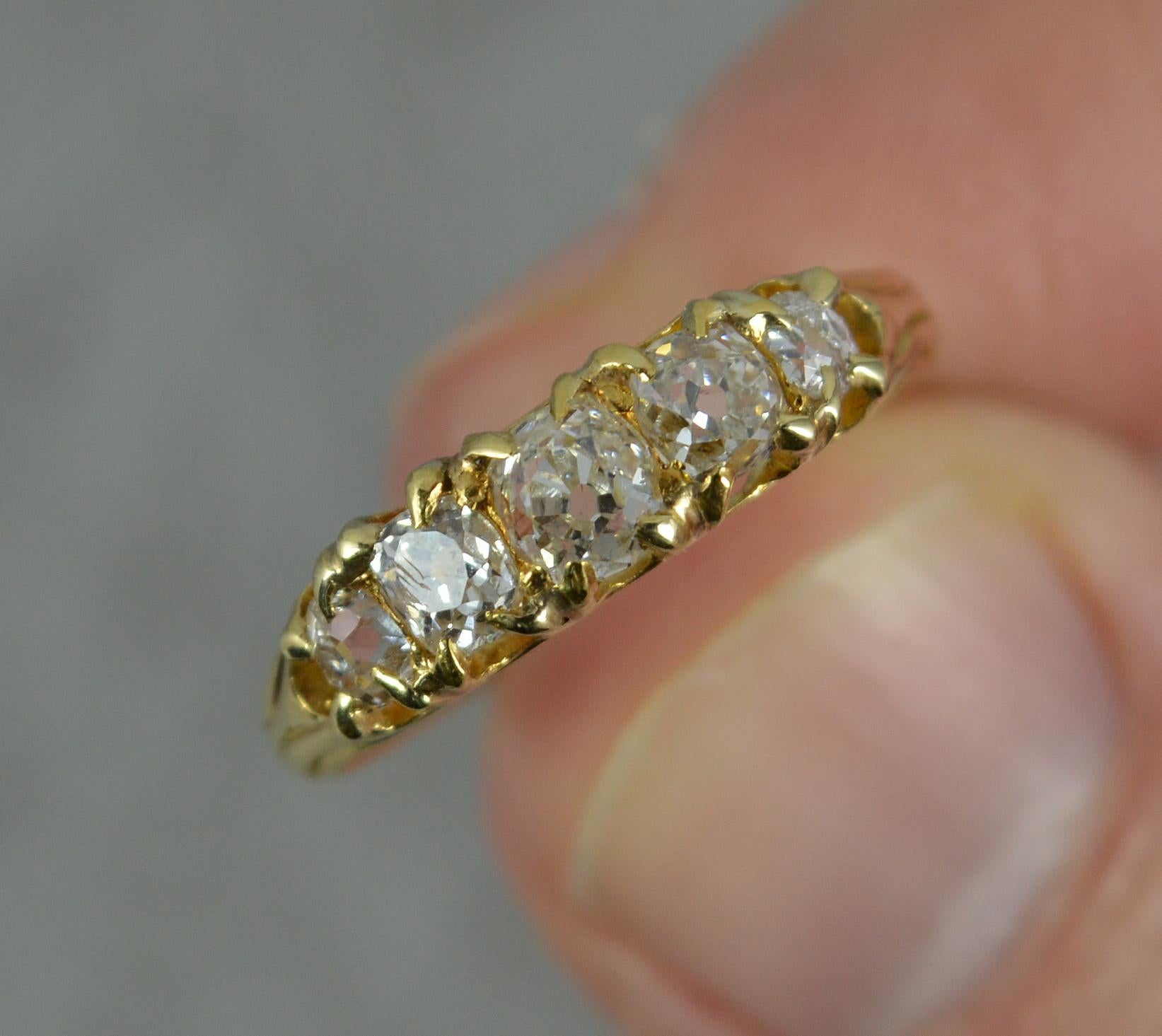 A stunning 18 carat gold and diamond five stone ring. c1890.
18 carat yellow gold example.
Designed with five natural old cut diamonds to total 0.75-0.8 carats approx. Graduated size. Clean diamonds, white and sparkly. All matching, very deep old