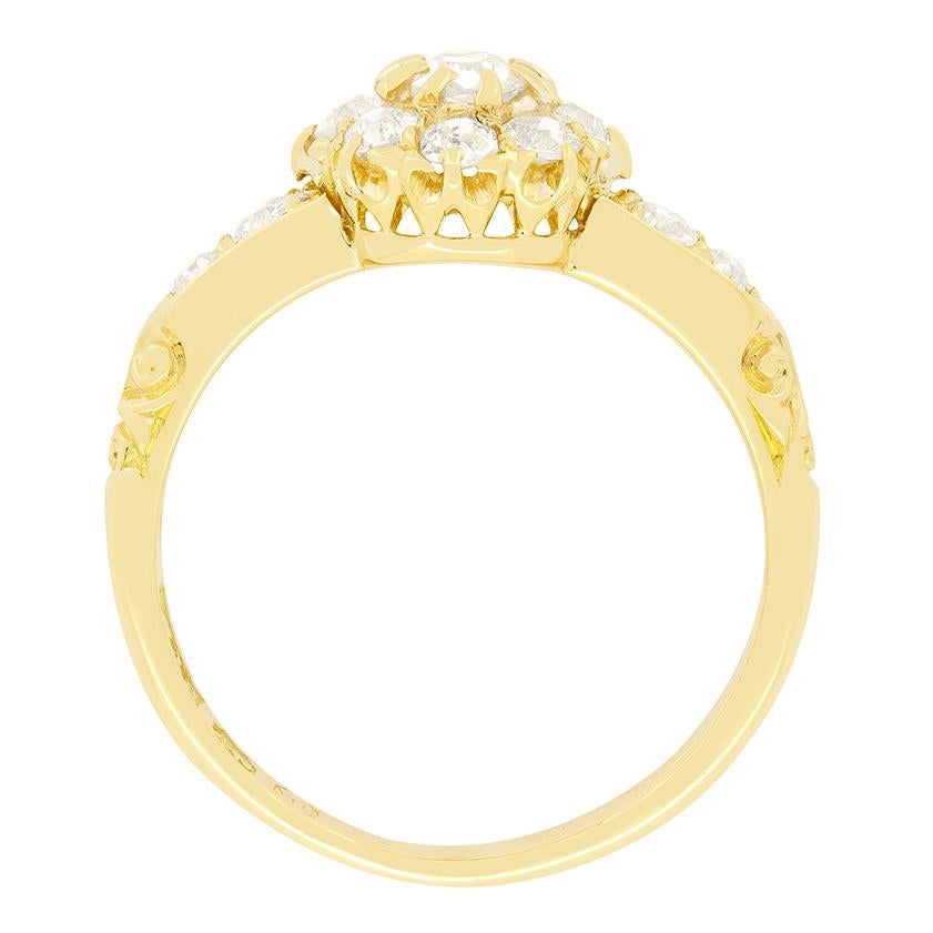 This beautiful daisy cluster ring dates back over 150 years to c.1869. A central 0.20 carat old cut diamond is surrounded by eight 0.05 carat diamonds of the same cut. The stones range in colour from H to I and in clarity from VS to SI, with all of