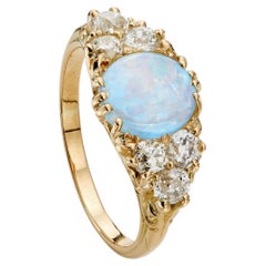 Ring aus 18 Karat Gelbgold mit einem Opal (0,90 Karat) im viktorianischen Stil und einem Diamanten (0,90 Karat) im Old-Mine-Schliff