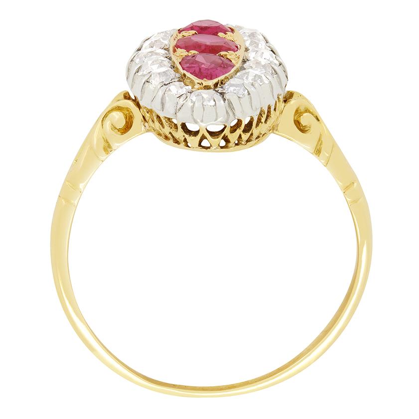 This exquisite Victorian pink sapphire and diamond boat ring is truly a one of a kind piece. Featuring a 0.40 carat oval cut pink sapphire at its centre, with a 0.25 carat pear cut pink sapphire set above and below. Each of the Sapphires are claw